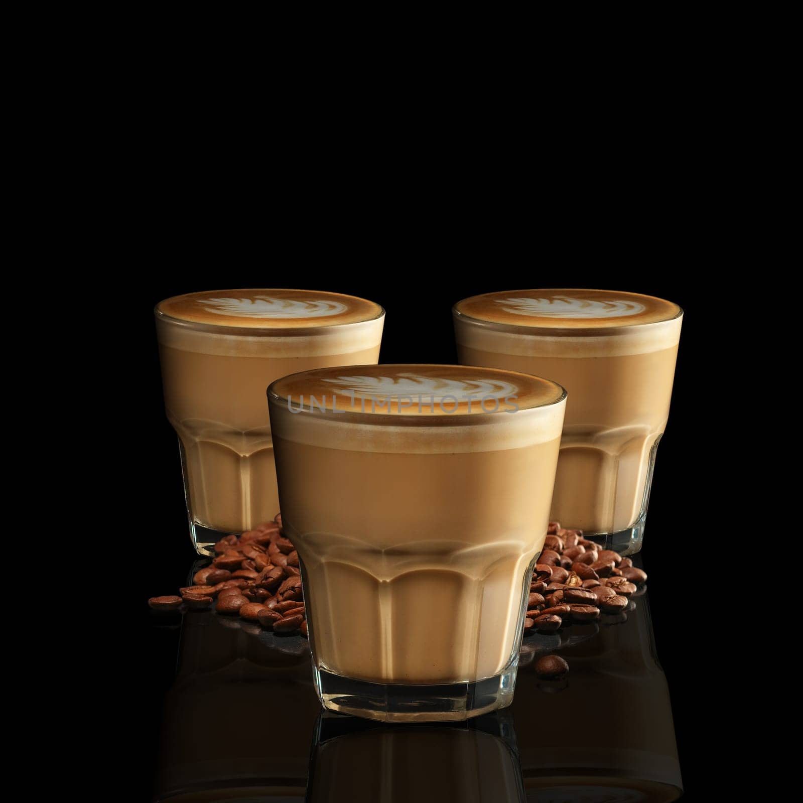 Three glasses of Cappuccino isolated on black