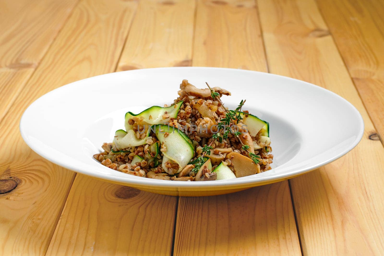 Boiled  buckwheat with marinated mushrooms and fresh cucumber