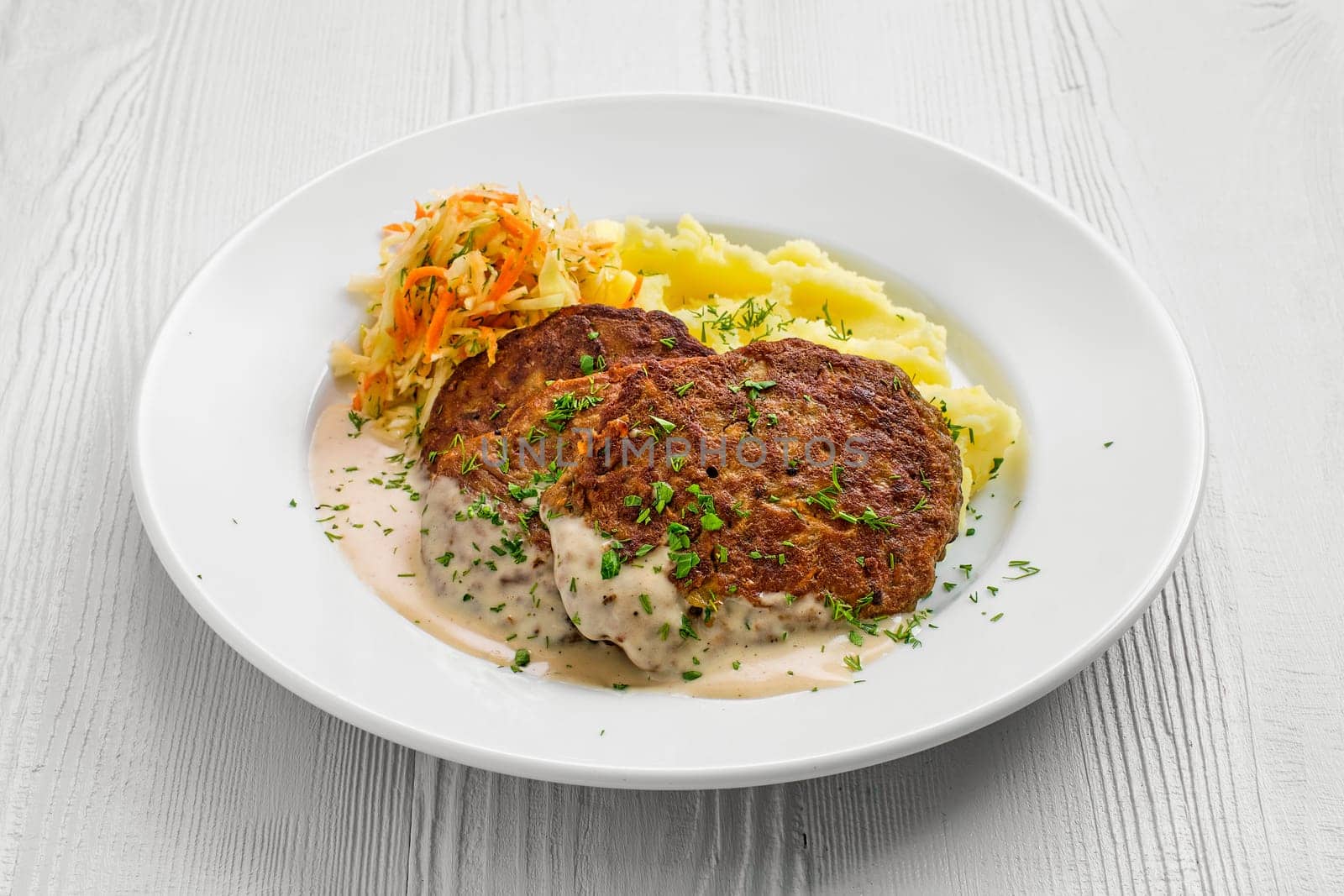 Plate with liver cutlet,mashed potato and pickled cabbage