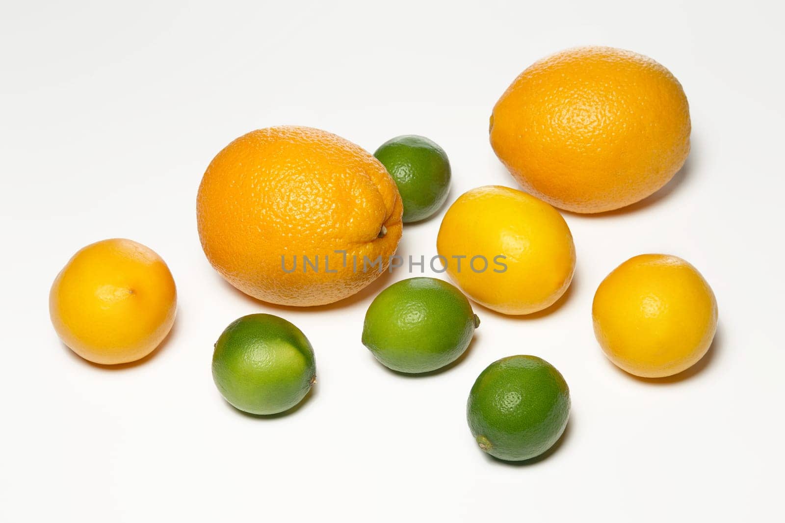 Top view of lemon, lime and orange on a white background with shadow