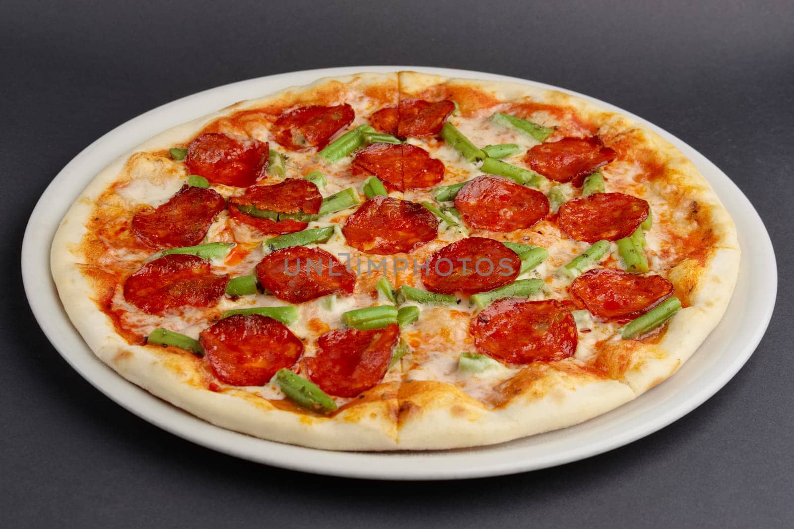 pizza pepperoni on black table
