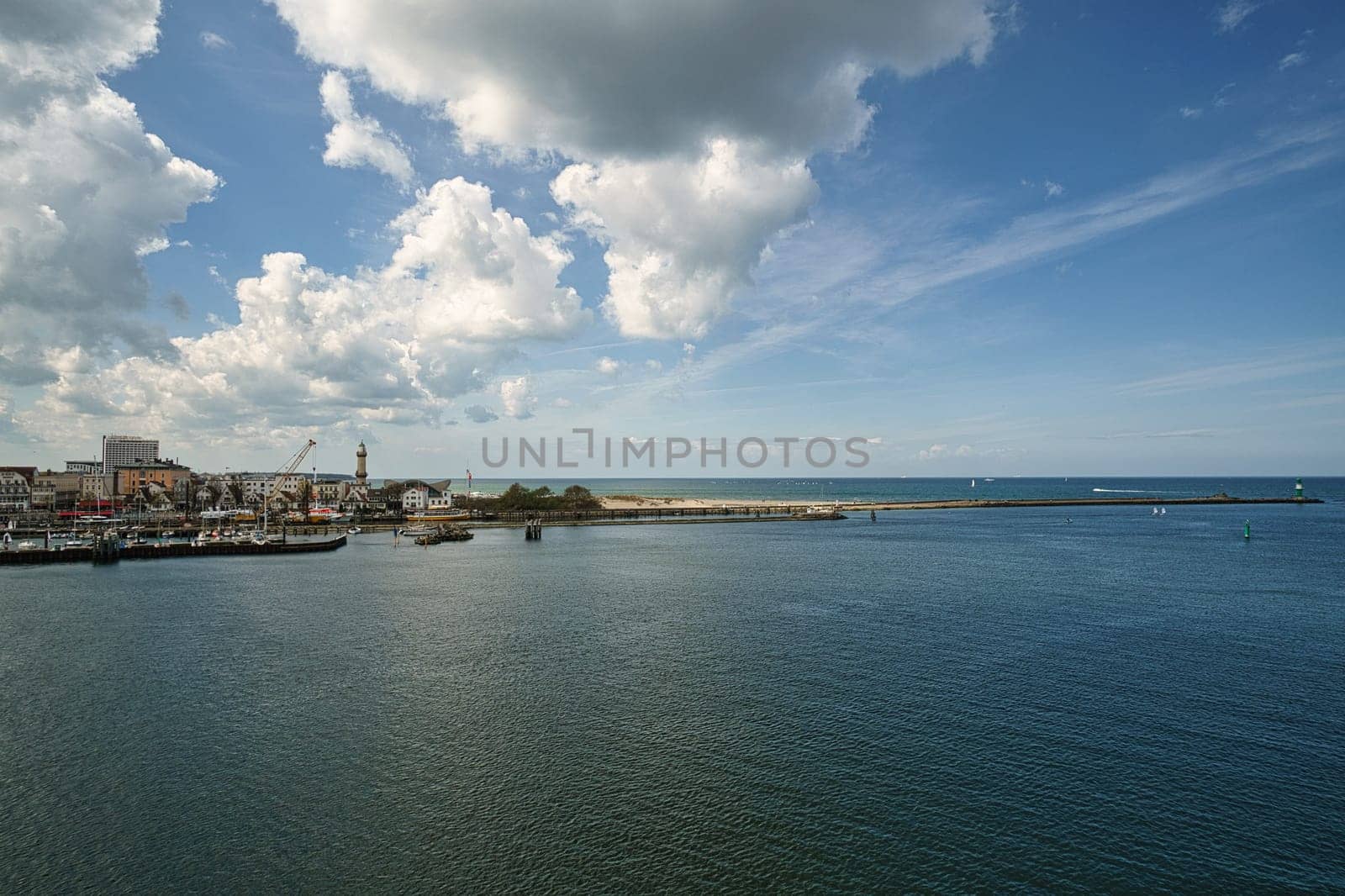 Rostock harbor exit. view over warnemünde, the beach and the lighthouse. Crossing to sweden or denmark.