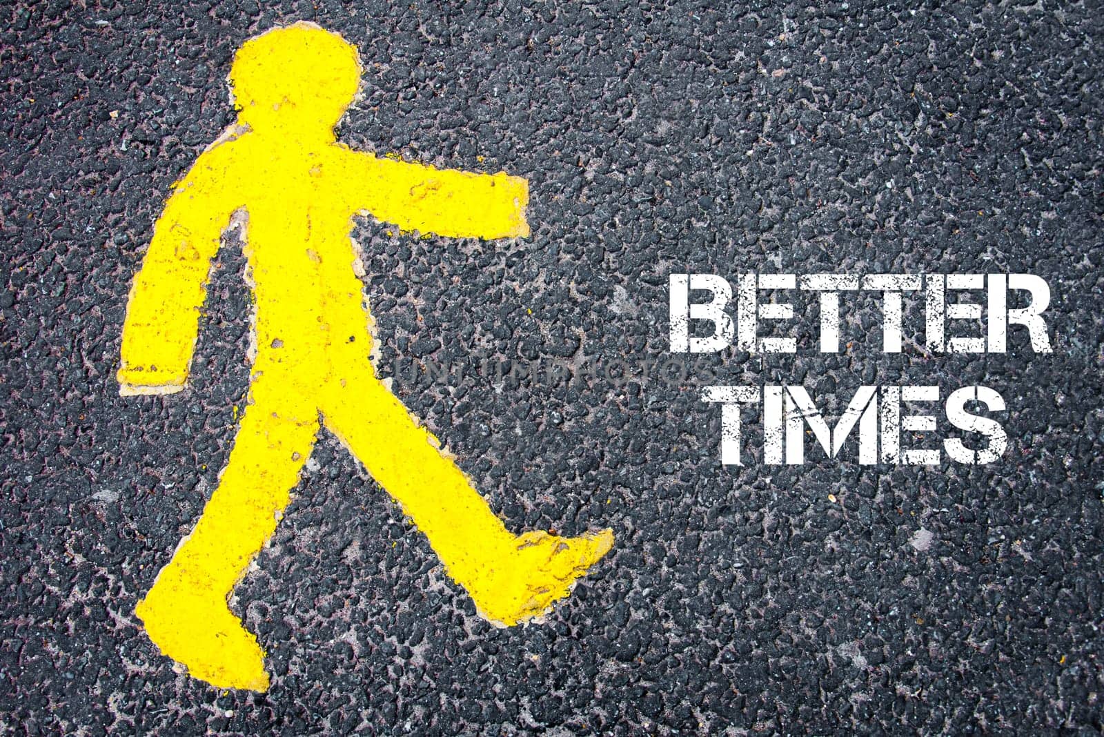 Yellow pedestrian figure on the road walking towards BETTER TIMES. Conceptual image with Text message over asphalt background.