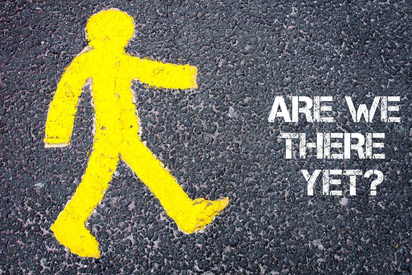 Yellow pedestrian figure on the road walking towards Are We There Yet Conceptual image with Text message over asphalt background.