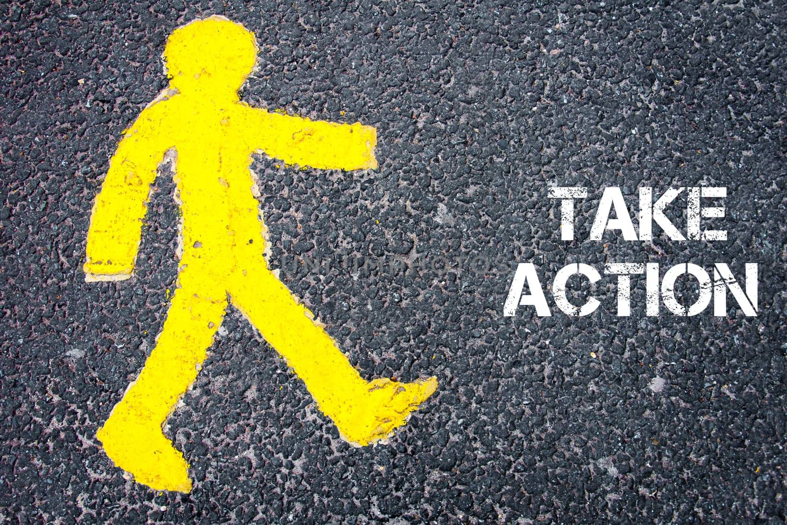 Yellow pedestrian figure on the road walking towards TAKE ACTION. Conceptual image with Text message over asphalt background.
