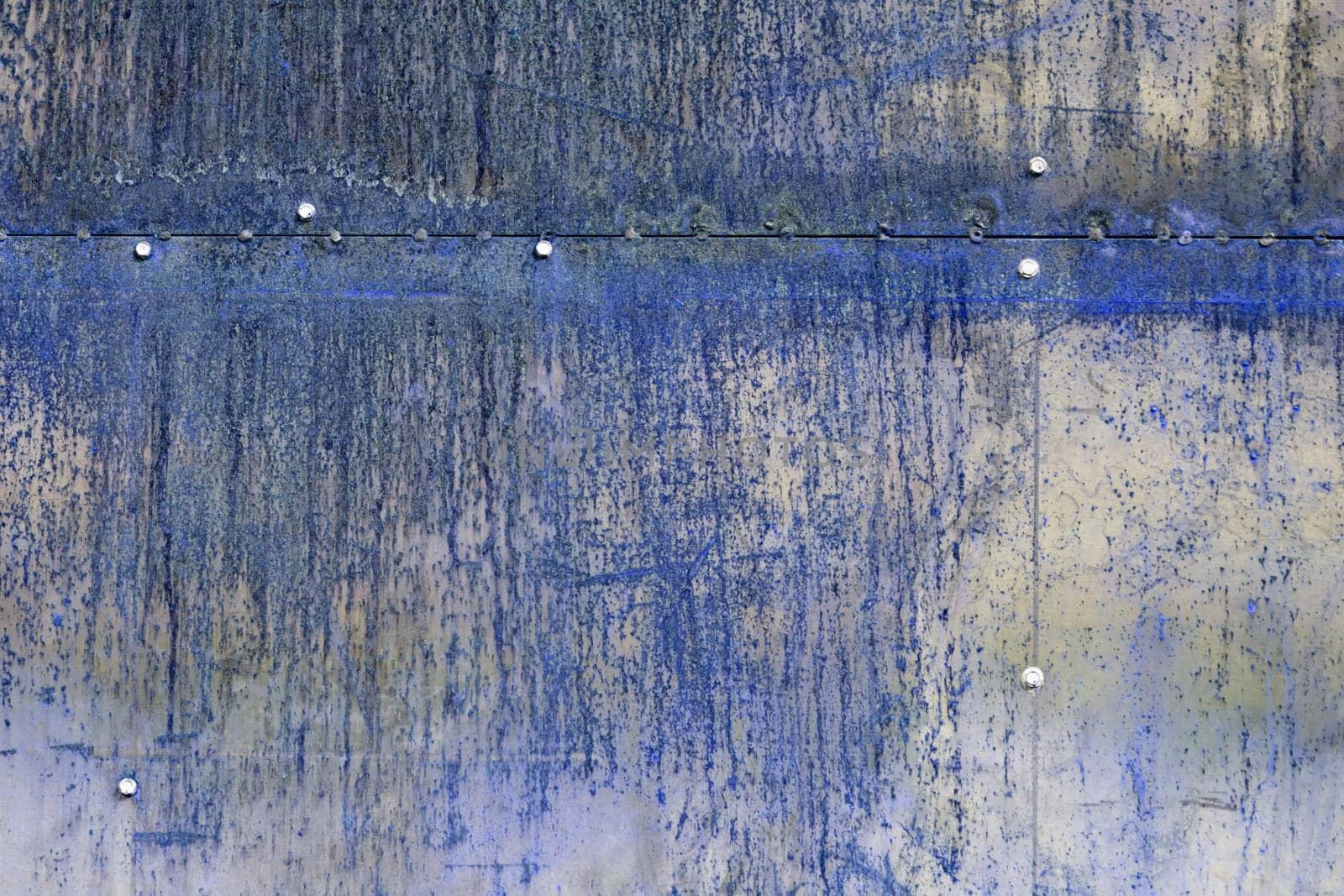 scratched and rusty blue metal surface as background