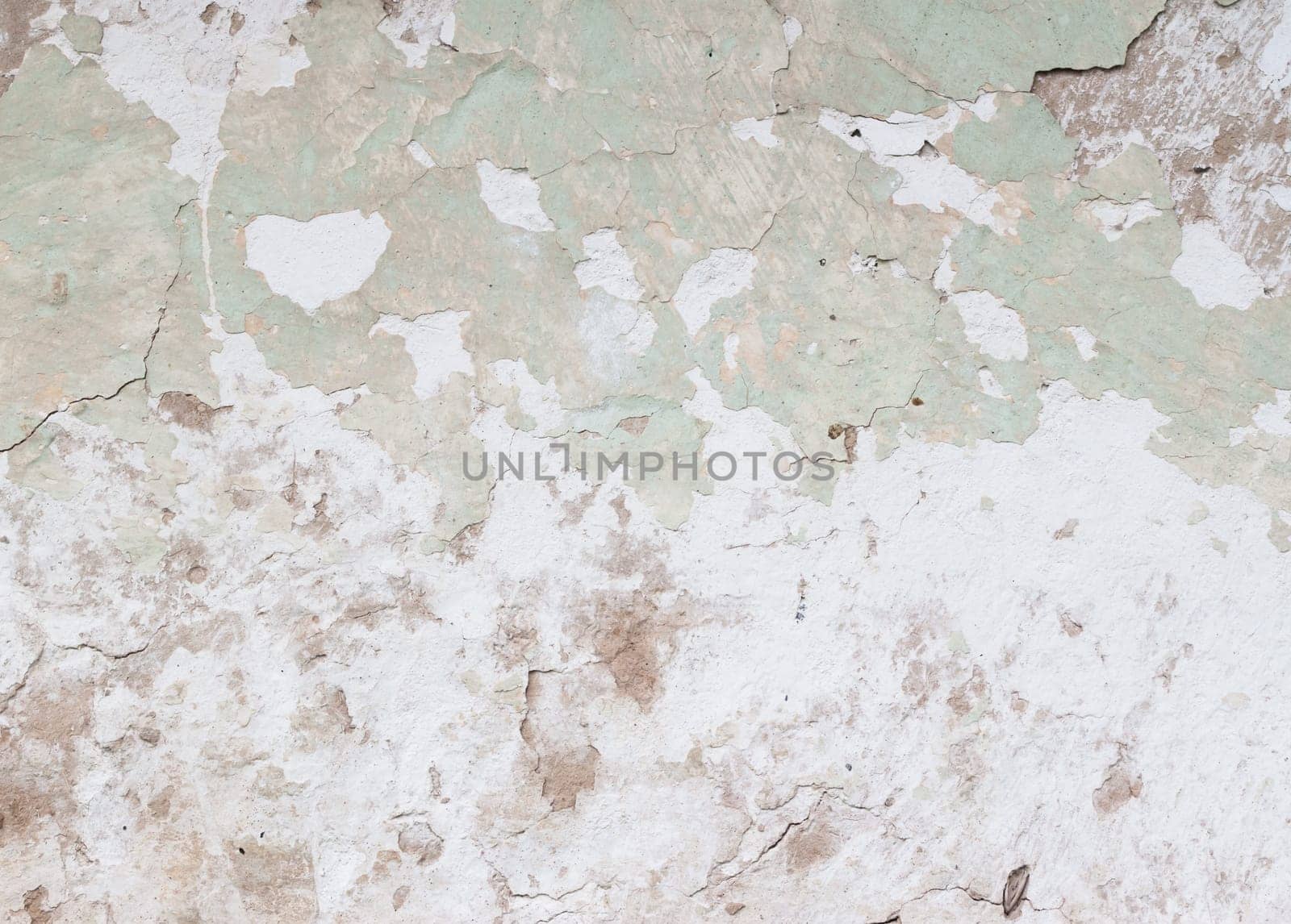old green earthen wall with peeling paint as background