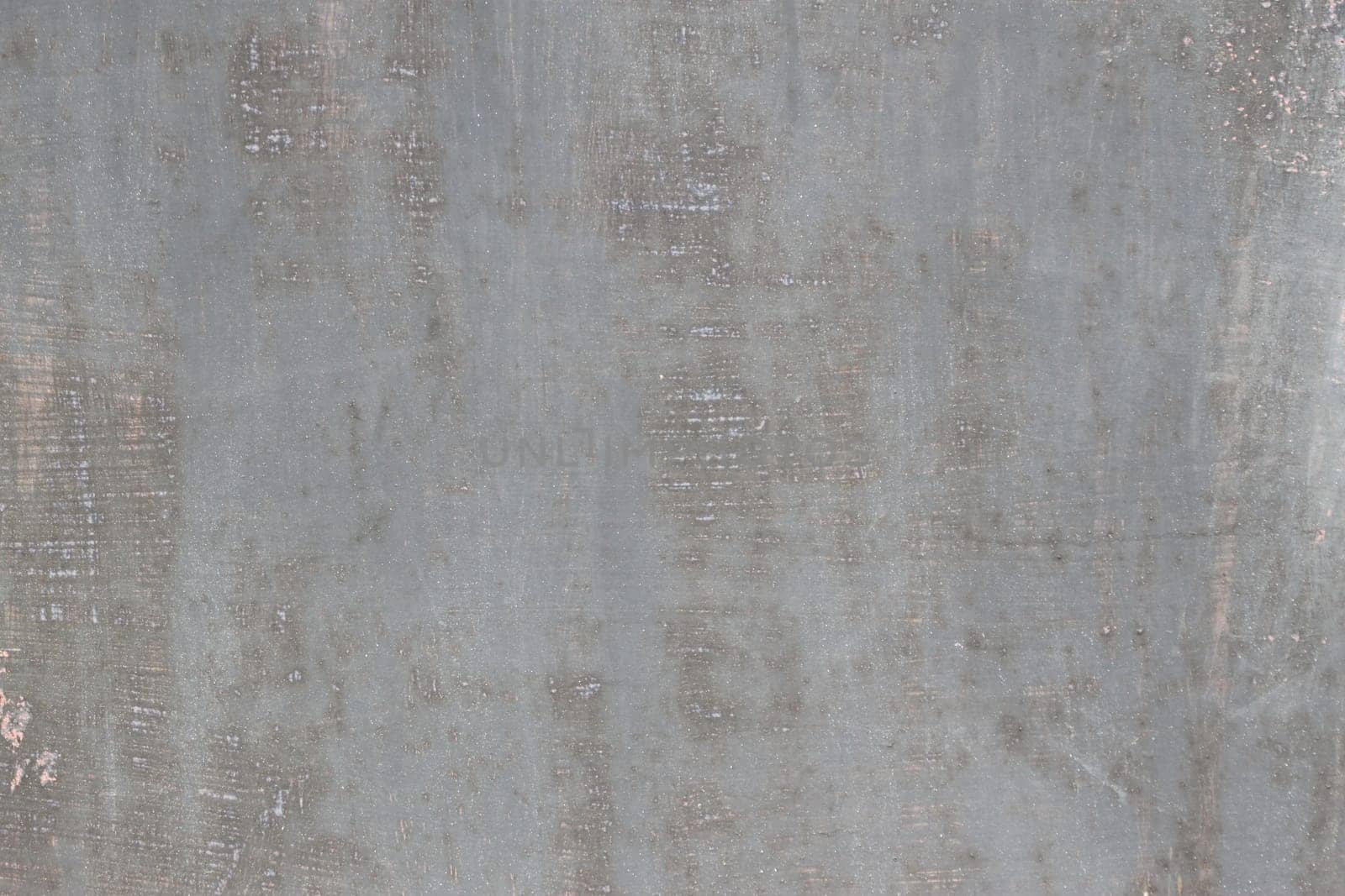 gray scratched metal surface with peeling paint