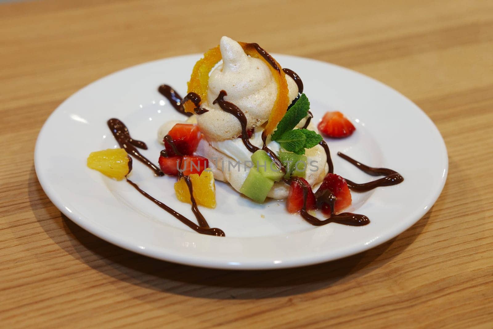 Homemade berry meringues (Zephyr) on a plate with fresh fruits