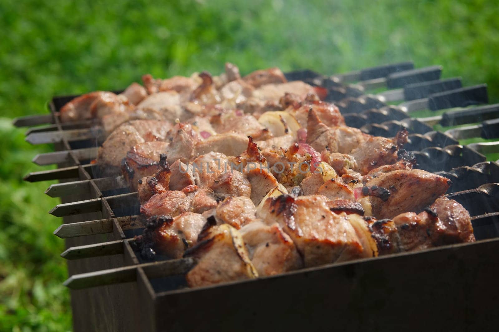 Process of cooking shashlik from pickled meat outdoor, img 7 of 17
