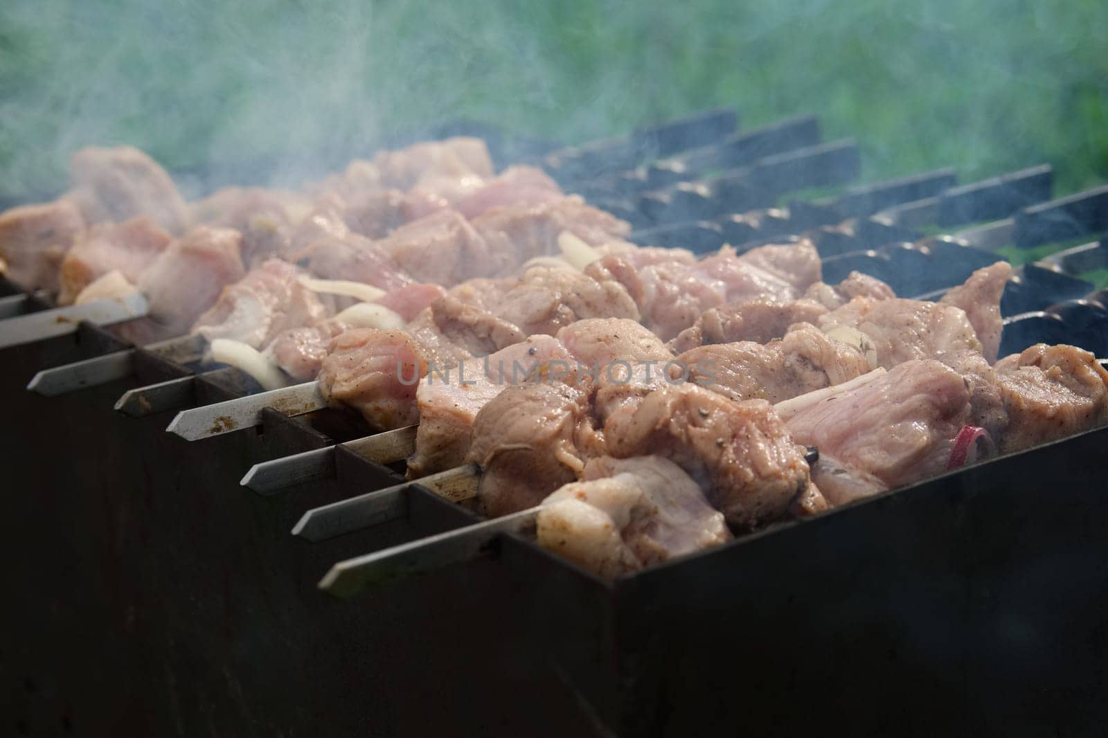 Process of cooking shashlik from pickled meat outdoor, img 6 of 17