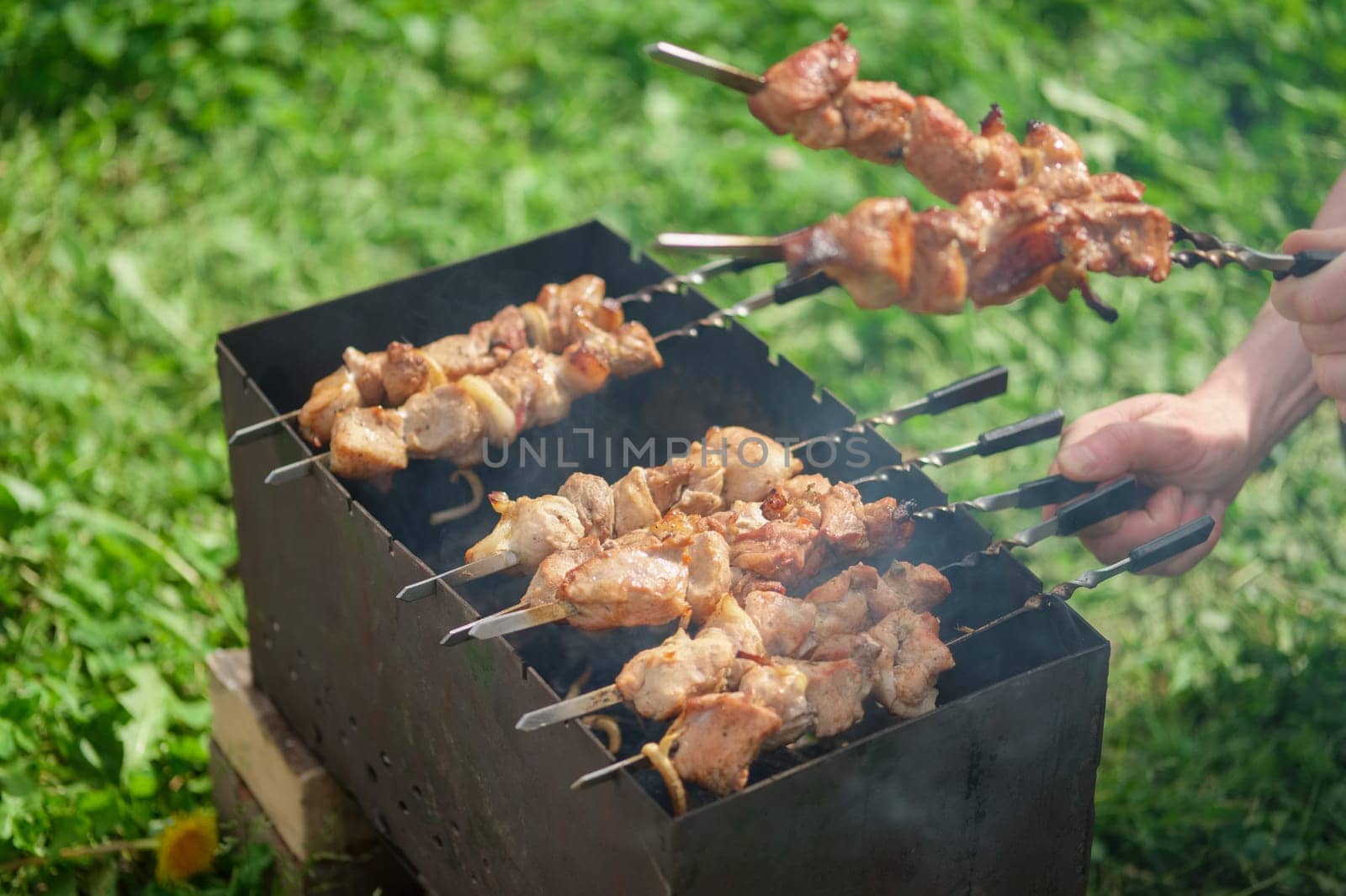 Process of cooking shashlik from pickled meat outdoor, img 14 of 17