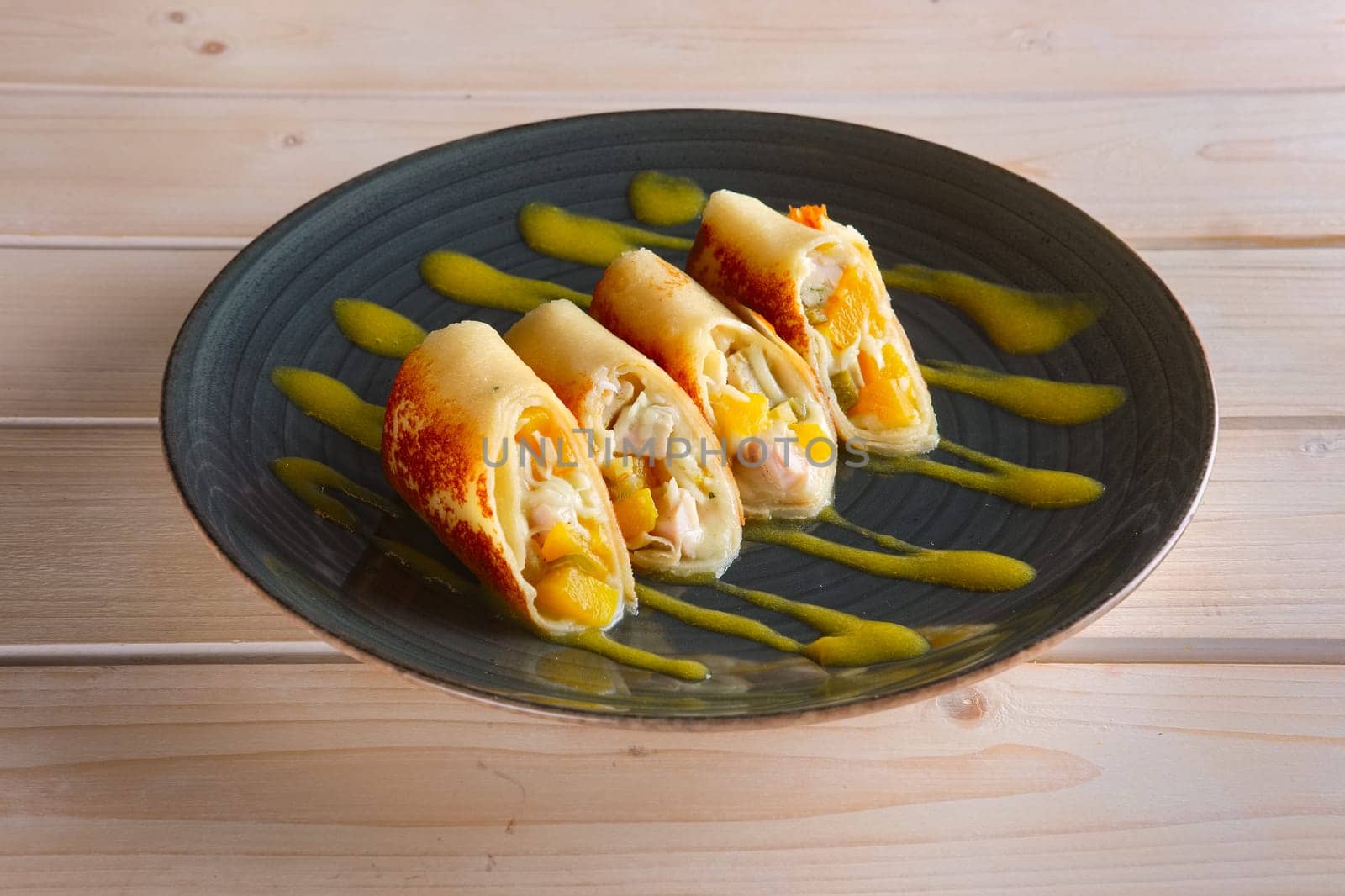 Thin pancakes with chicken and pineapple