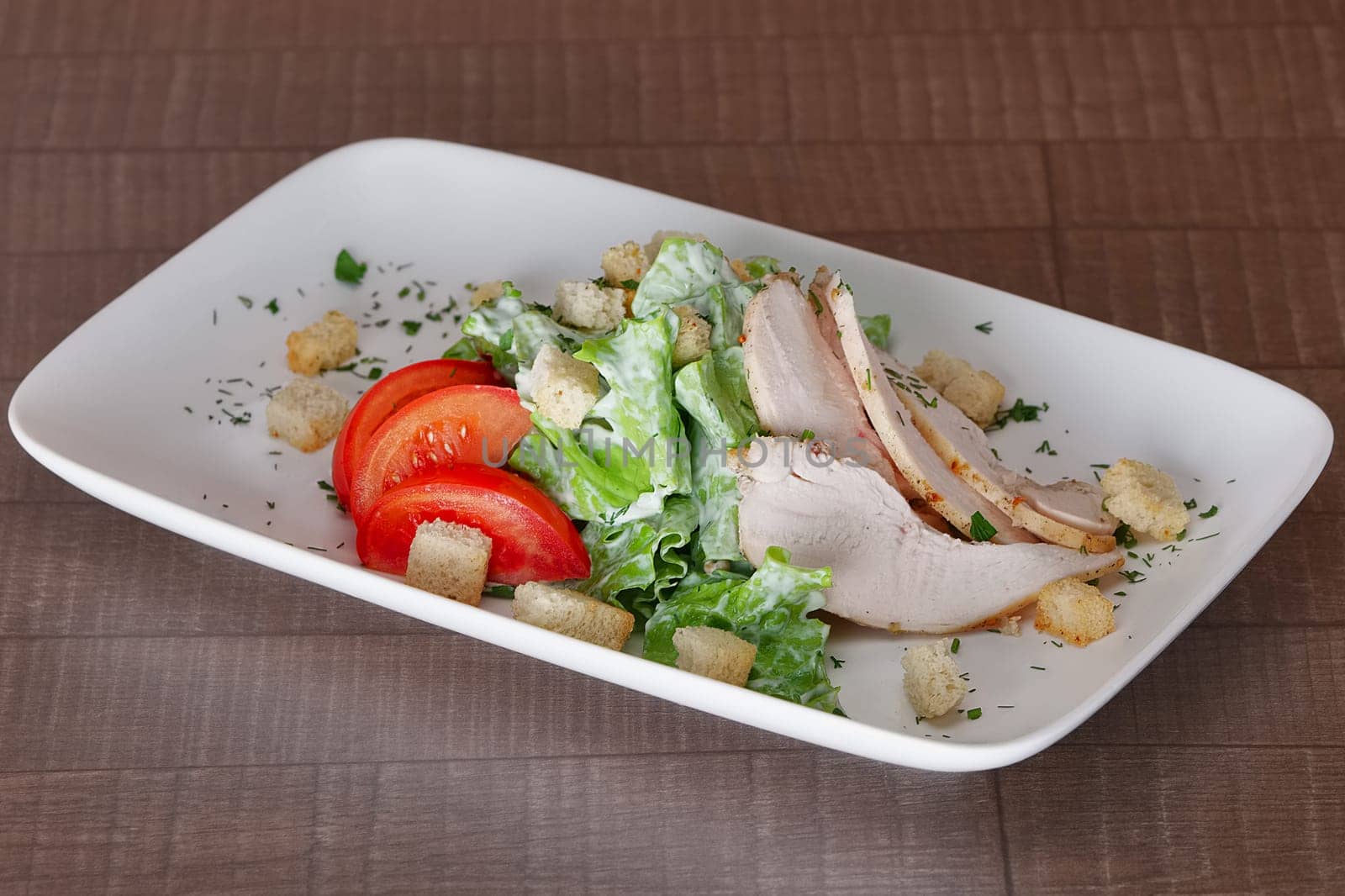 Vegetable salad with fried chicken meat. Greek salad.