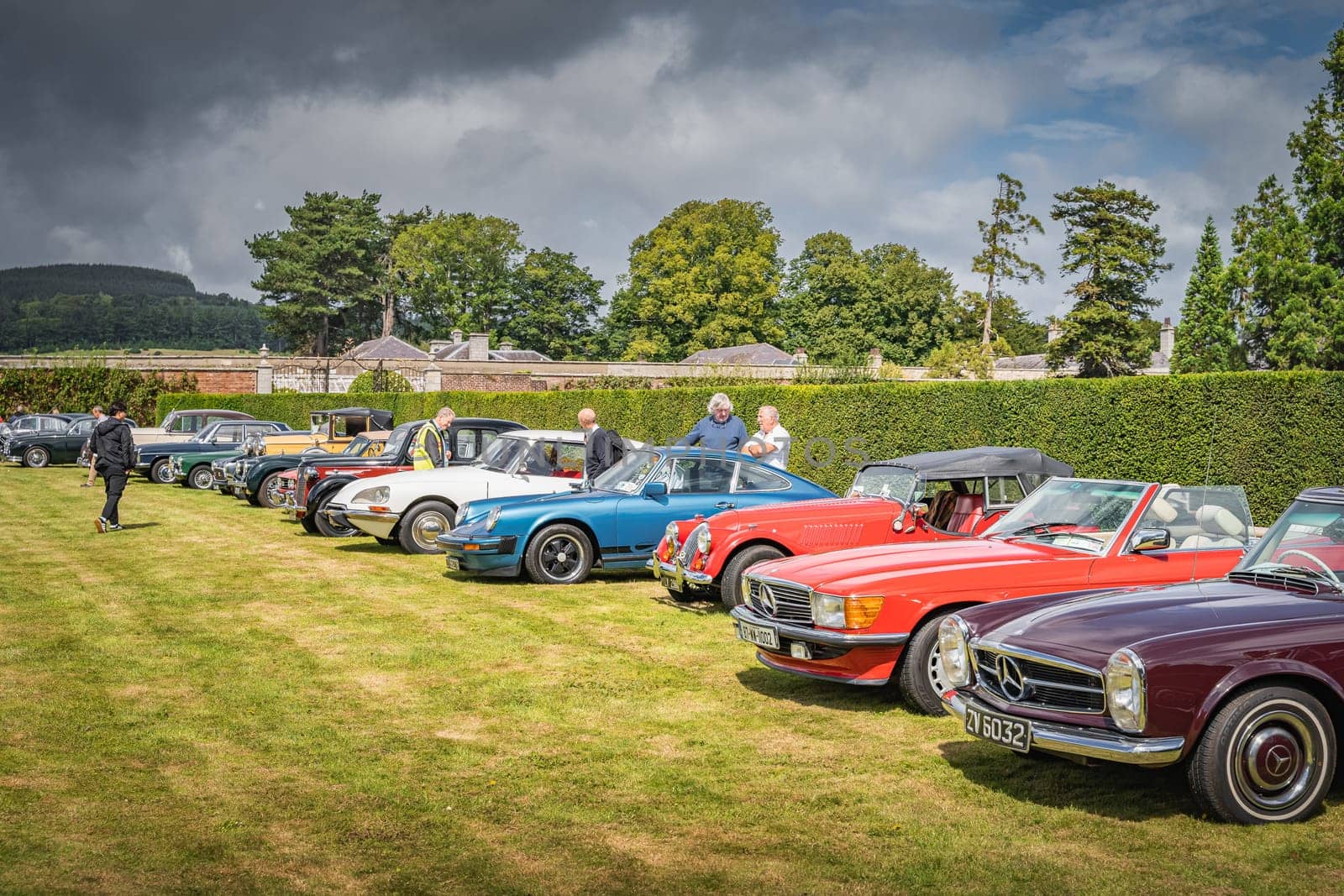 Wicklow, Ireland, August 2019 Irish Veteran and Vintage Car Club in Powerscourt, people admiring beautiful vintage cars