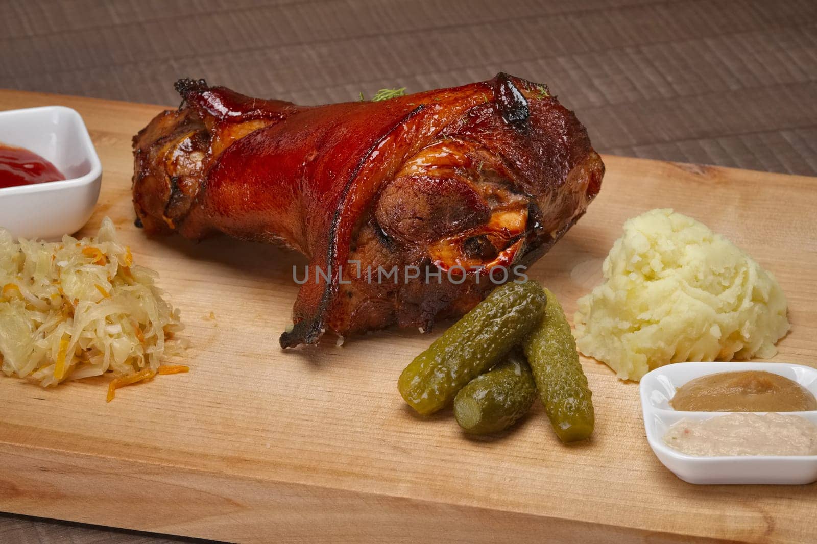 side view of knuckle with mashed potato and sauerkraut
