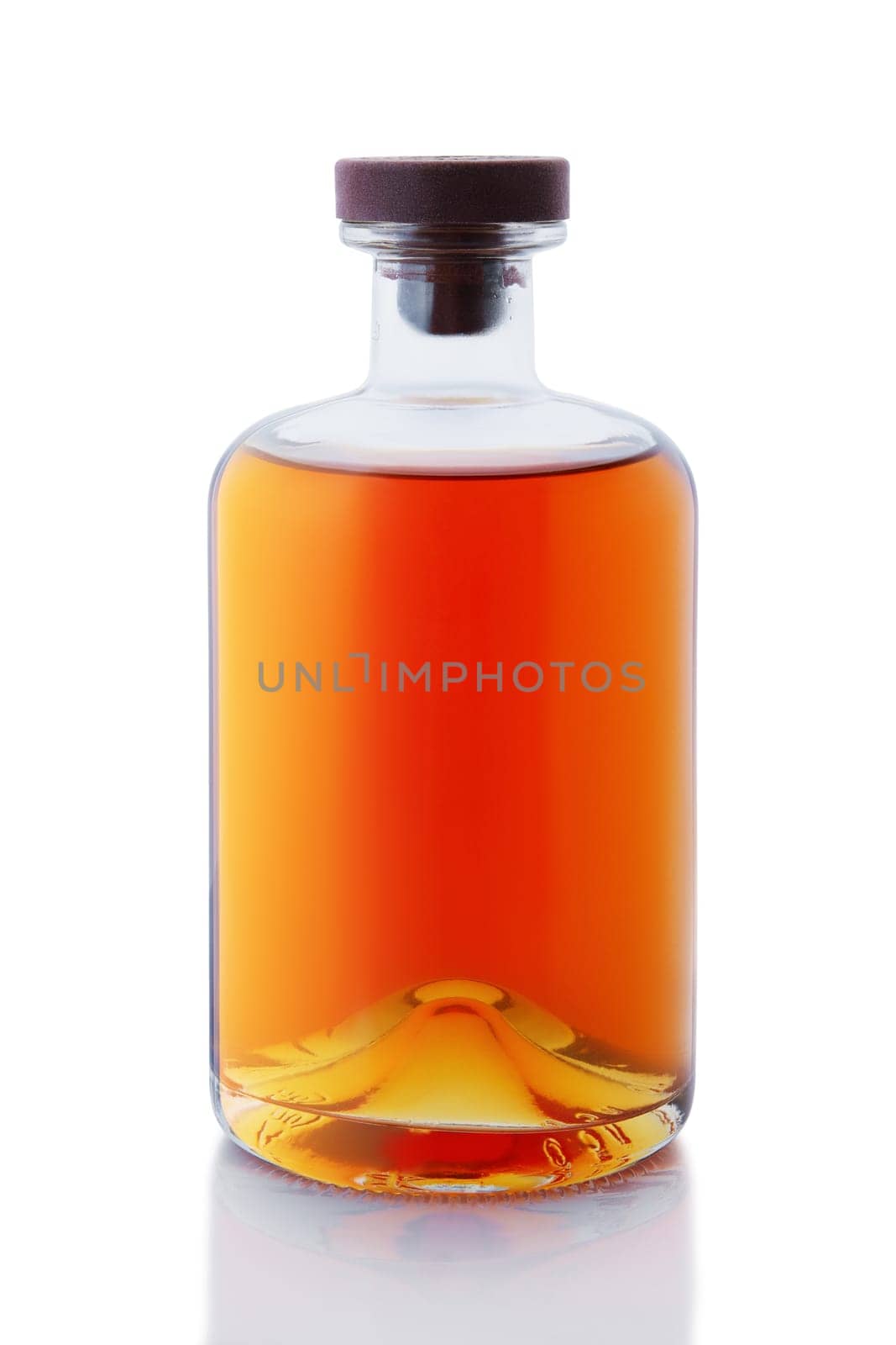 Vintage no name, no brand bottle with whiskey or brandy isolated on white background