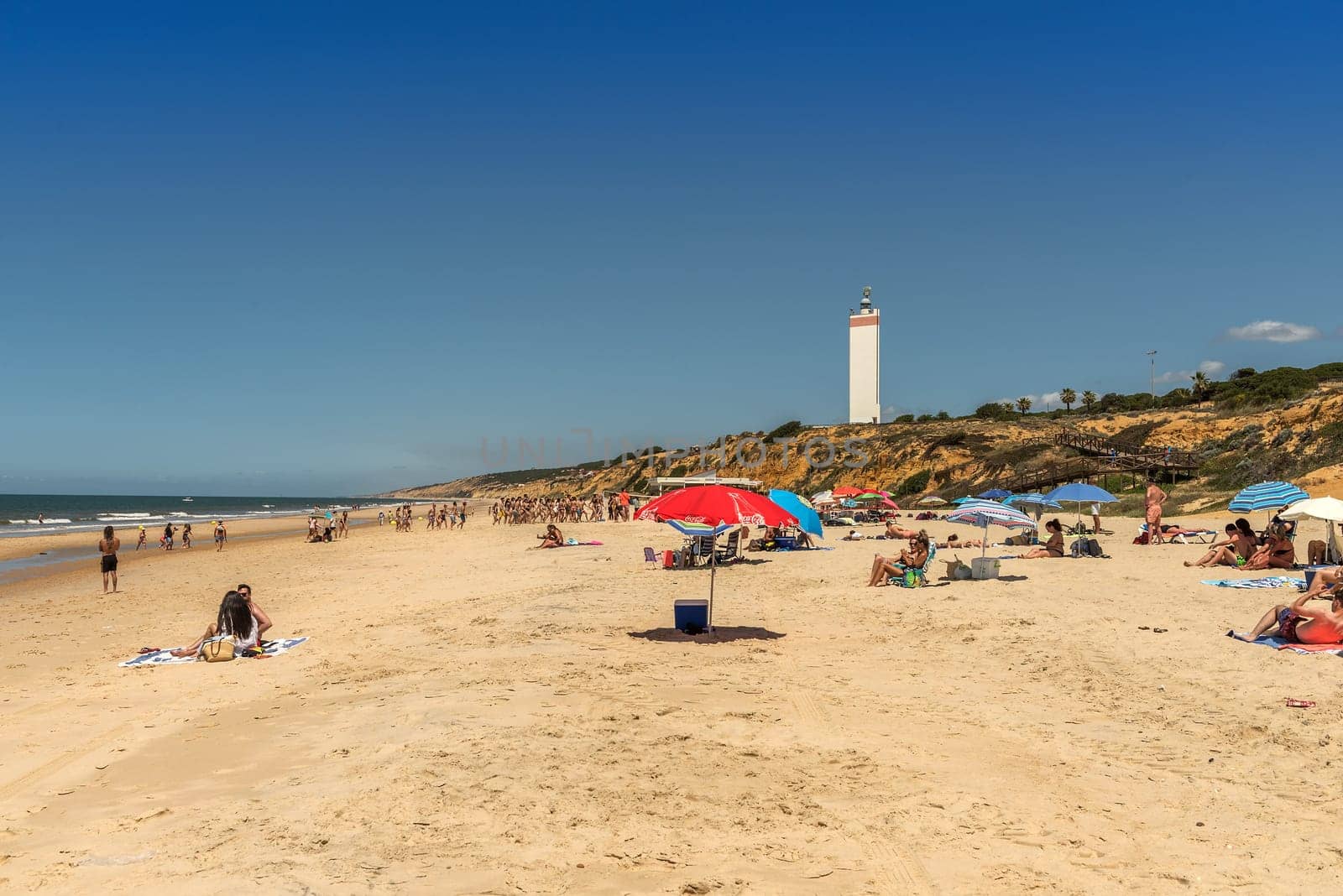 Tourists on the beach of Matalascanas, Andalusia, Spain