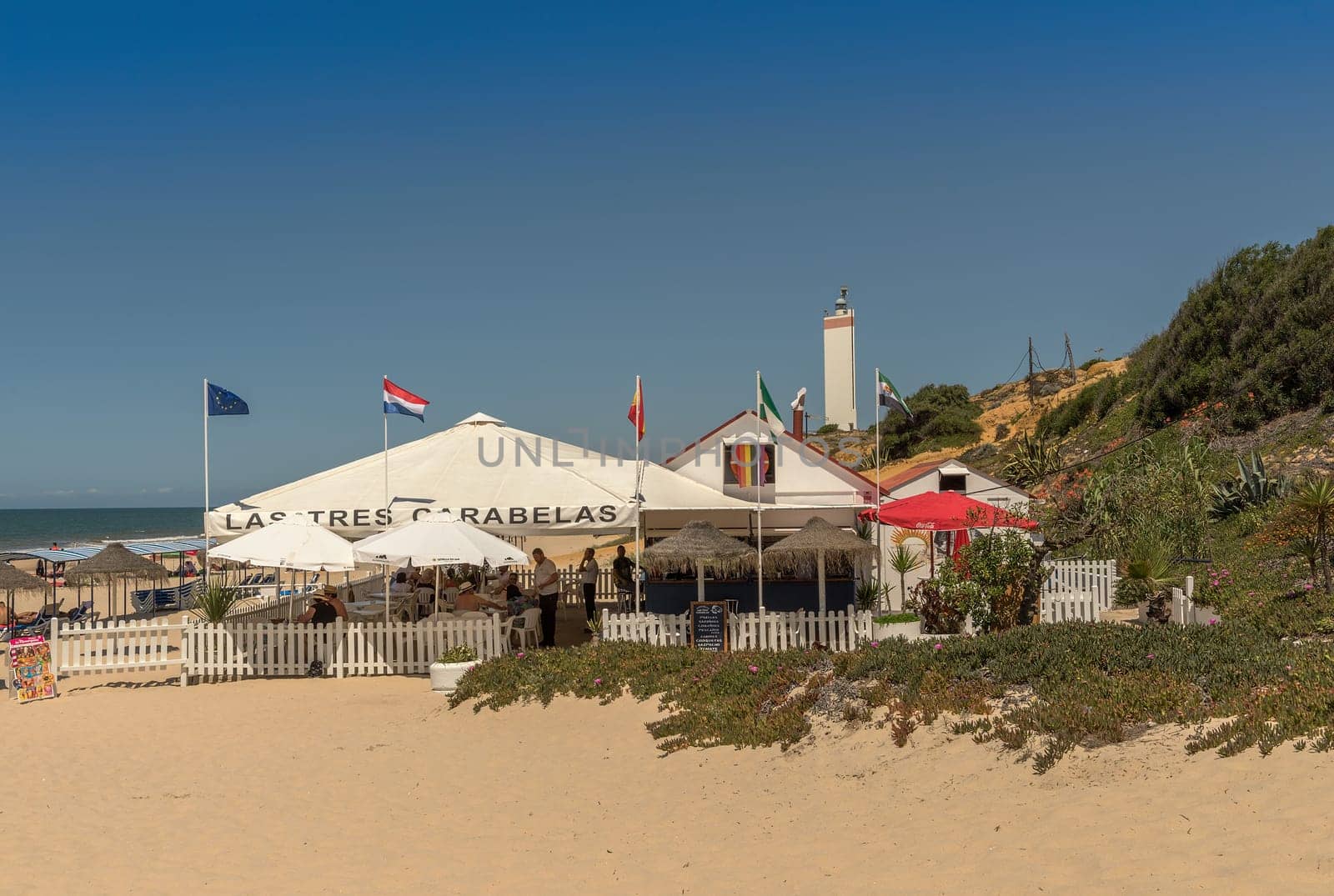 Tourists on the beach of Matalascanas, Andalusia, Spain