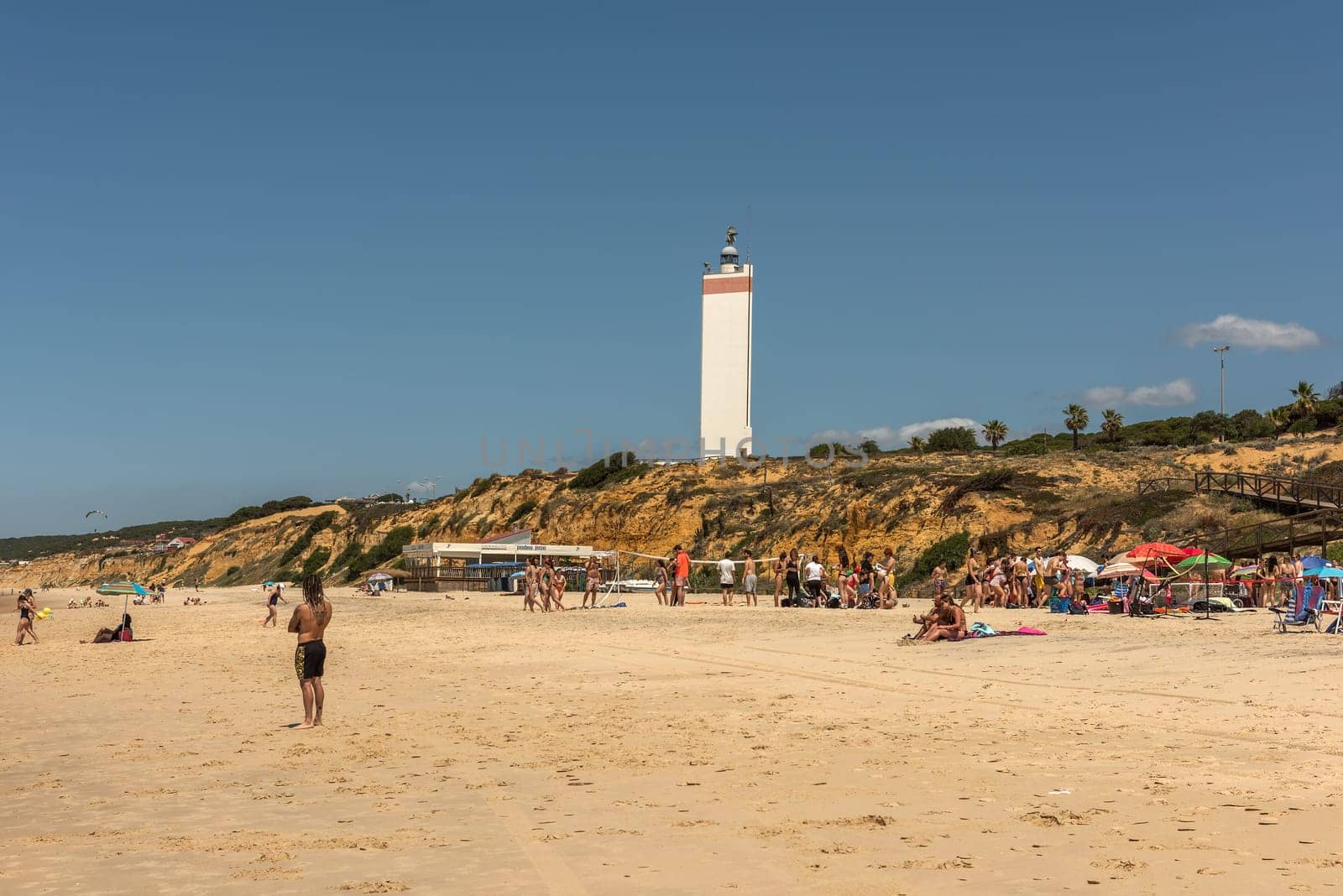 Tourists on the beach of Matalascanas, Andalusia, Spain