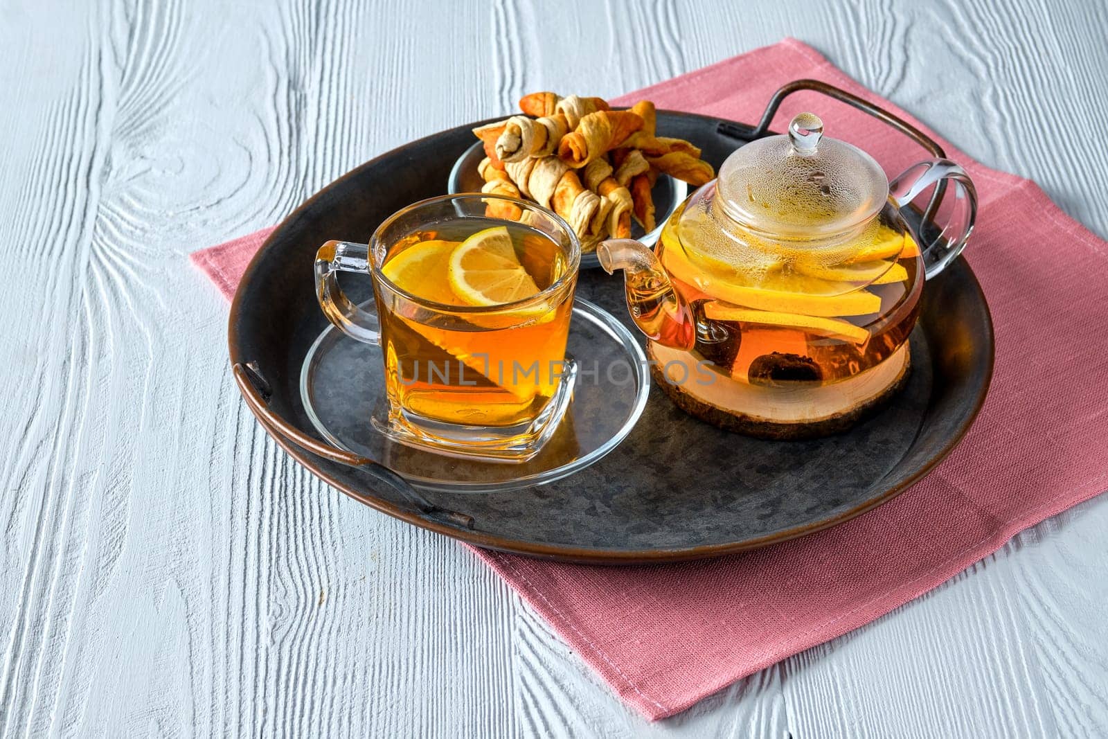 Top view of citrus tea on white wooden table