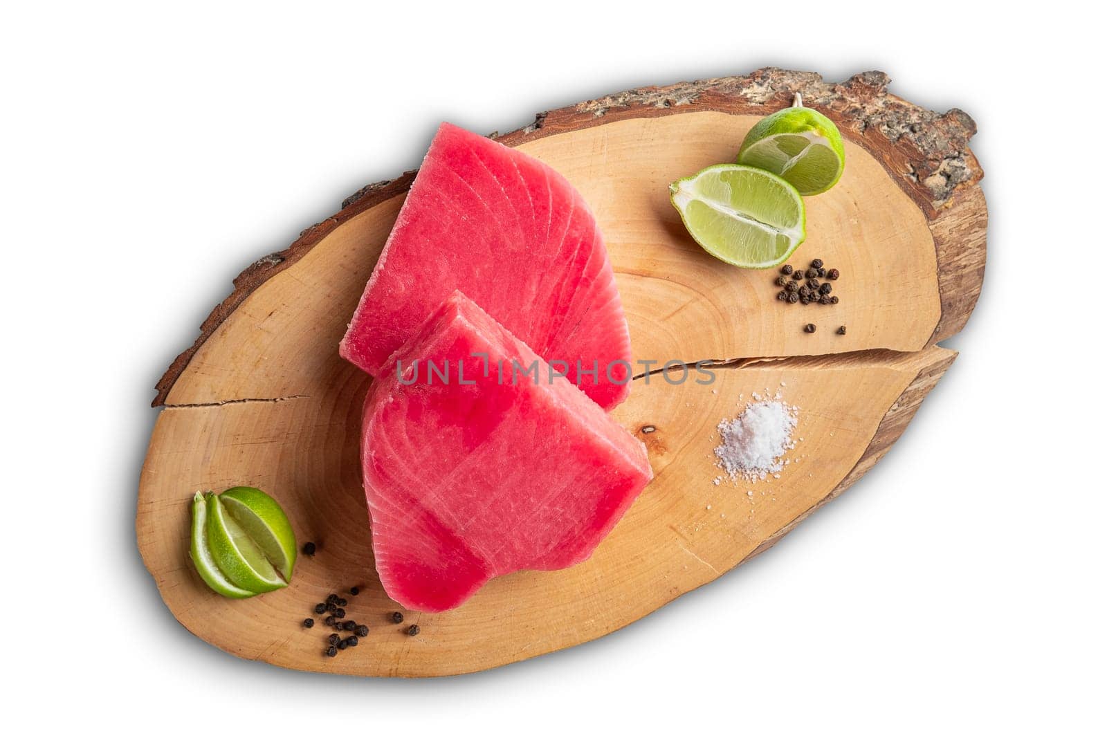 Fresh raw tuna steak on wooden cutting board, top view isolated on white