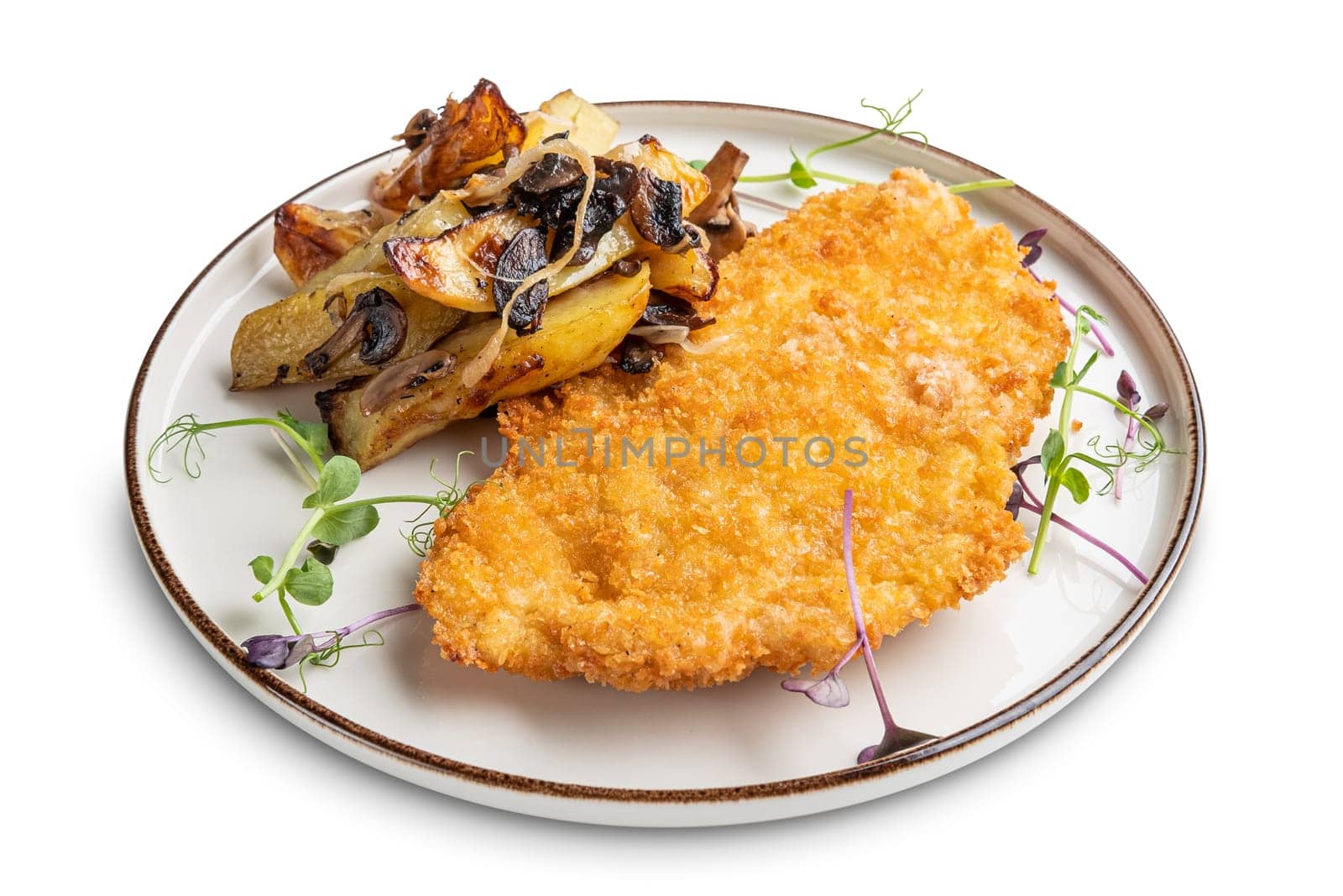 Tasty schnitzel in breading with fried potato, onion and mushrooms