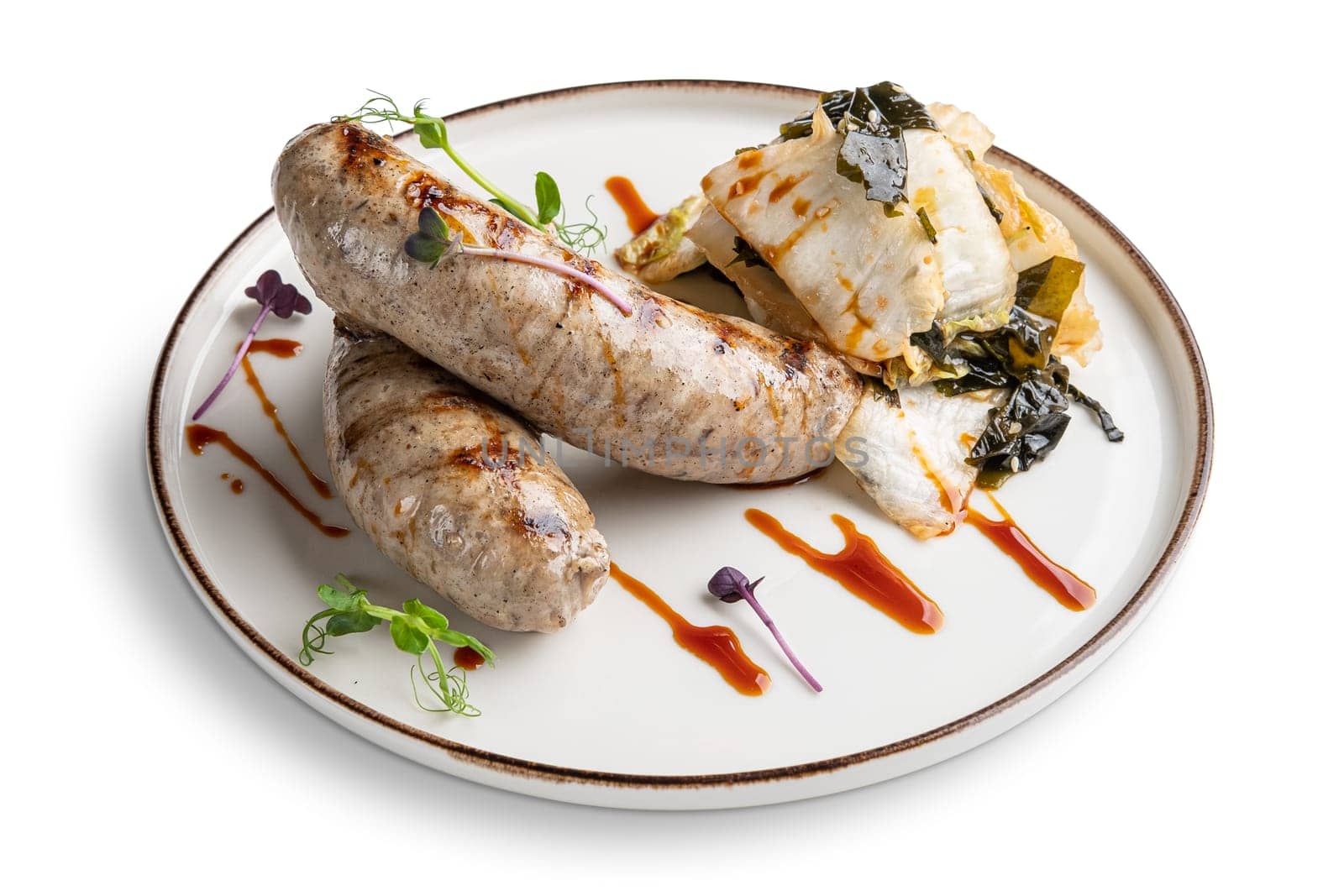 Fried Weisswurst (white veal sausage) with marinated cabbage and sea wed