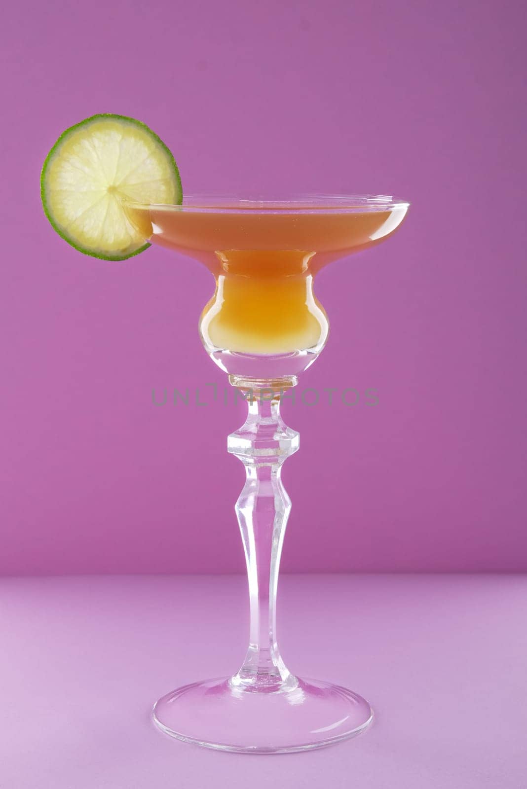 Cocktail brown derby on violet background