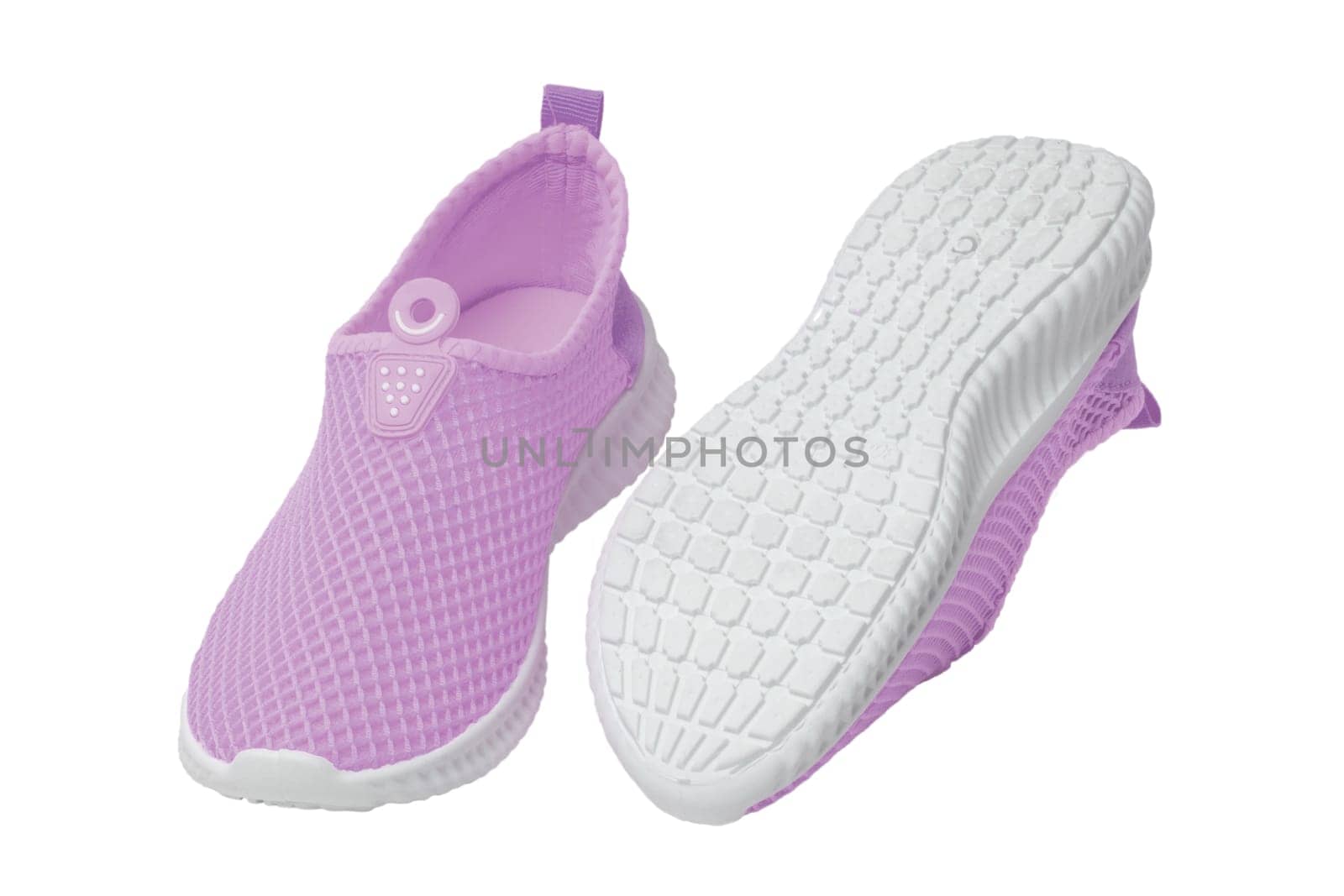 Pink sneaker isolated. Close-up of women's trendy athletic shoes or sport sneakers isolated on a white background. Modern footwear design for workout. Macro.