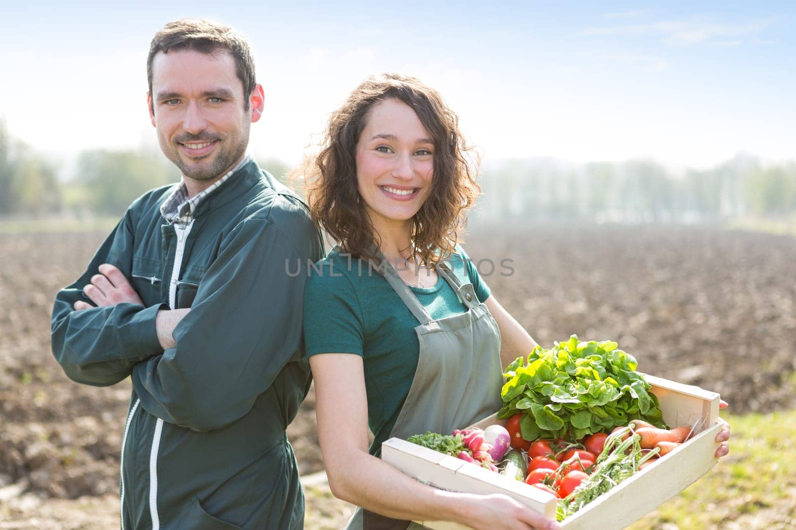 VIew of a Farmer team at work in a field