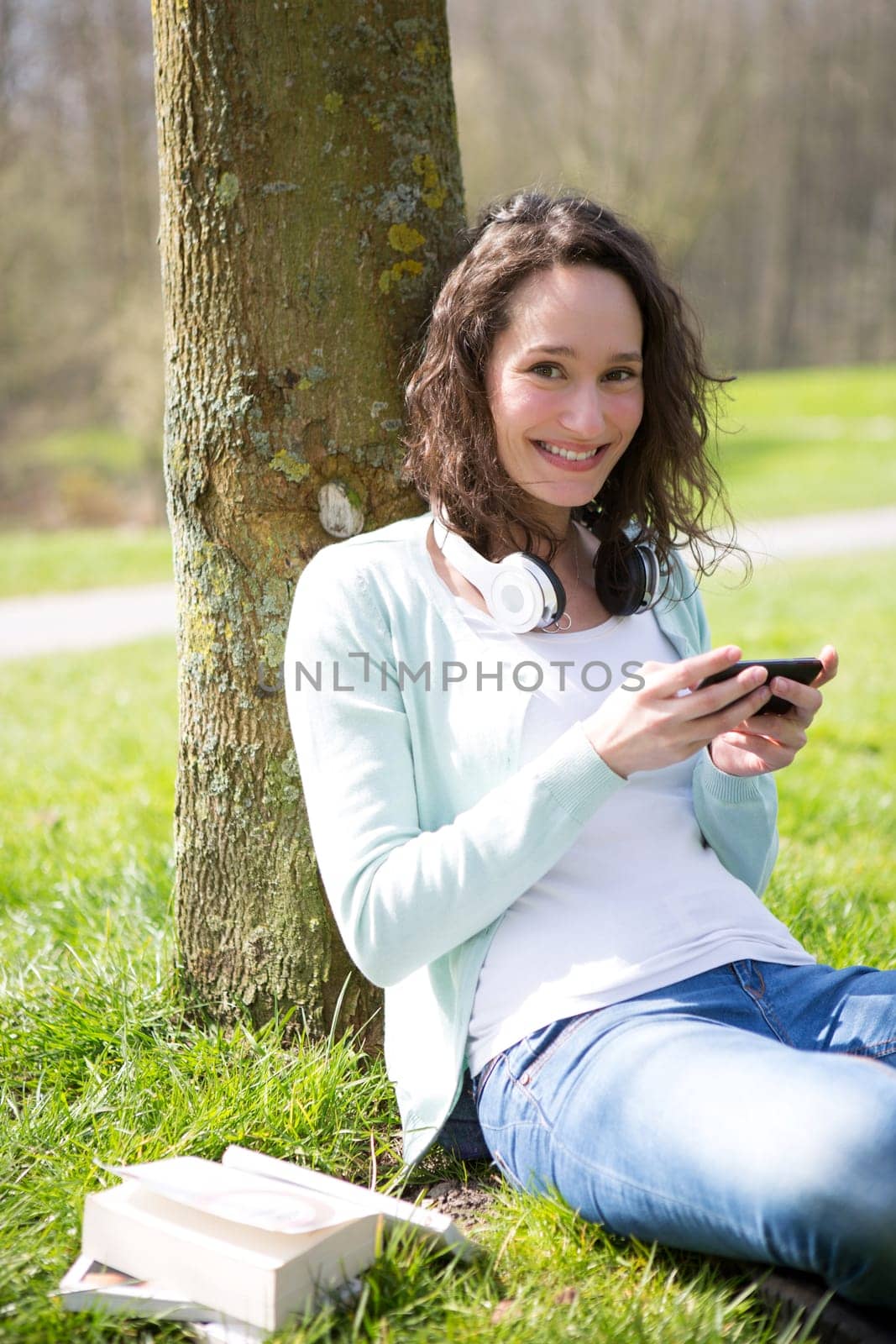 View of a Young attractive woman realxing at the park