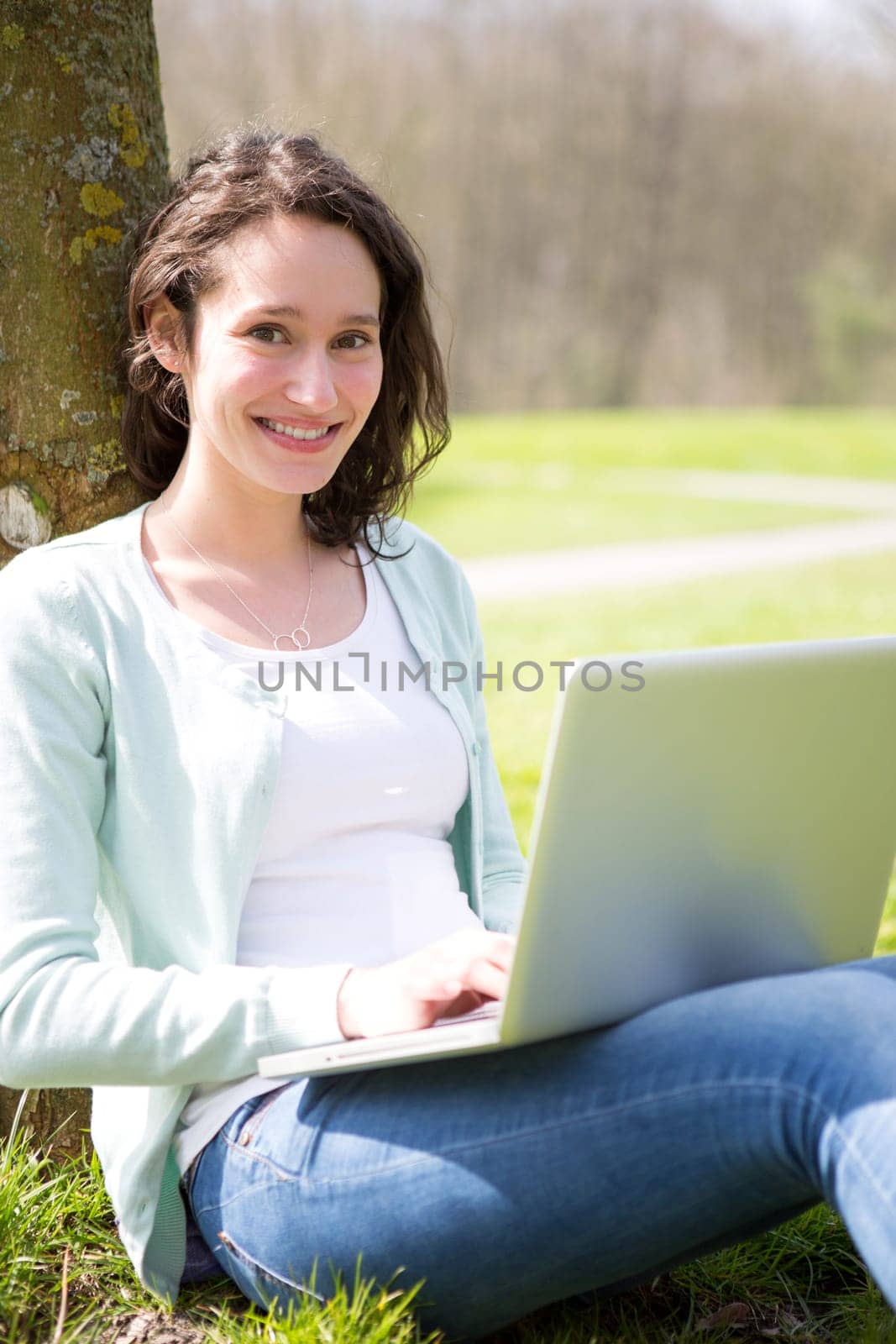 View of a Young attractive woman realxing at the park