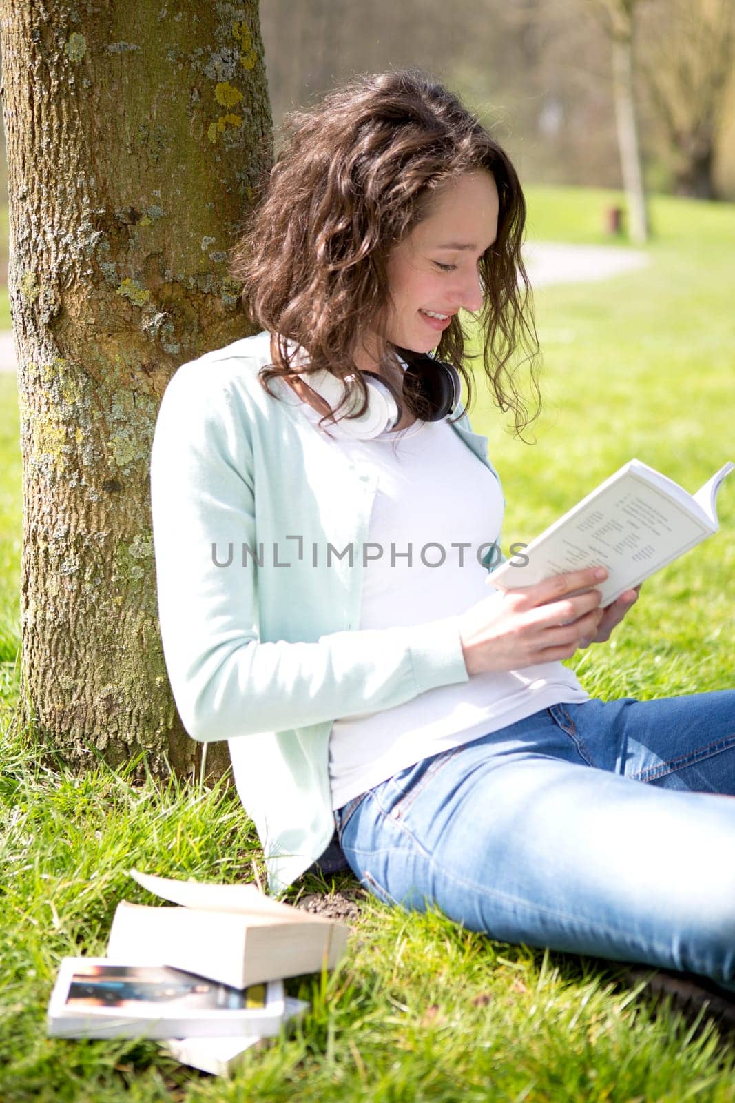 View of a Young attractive woman realxing at the park