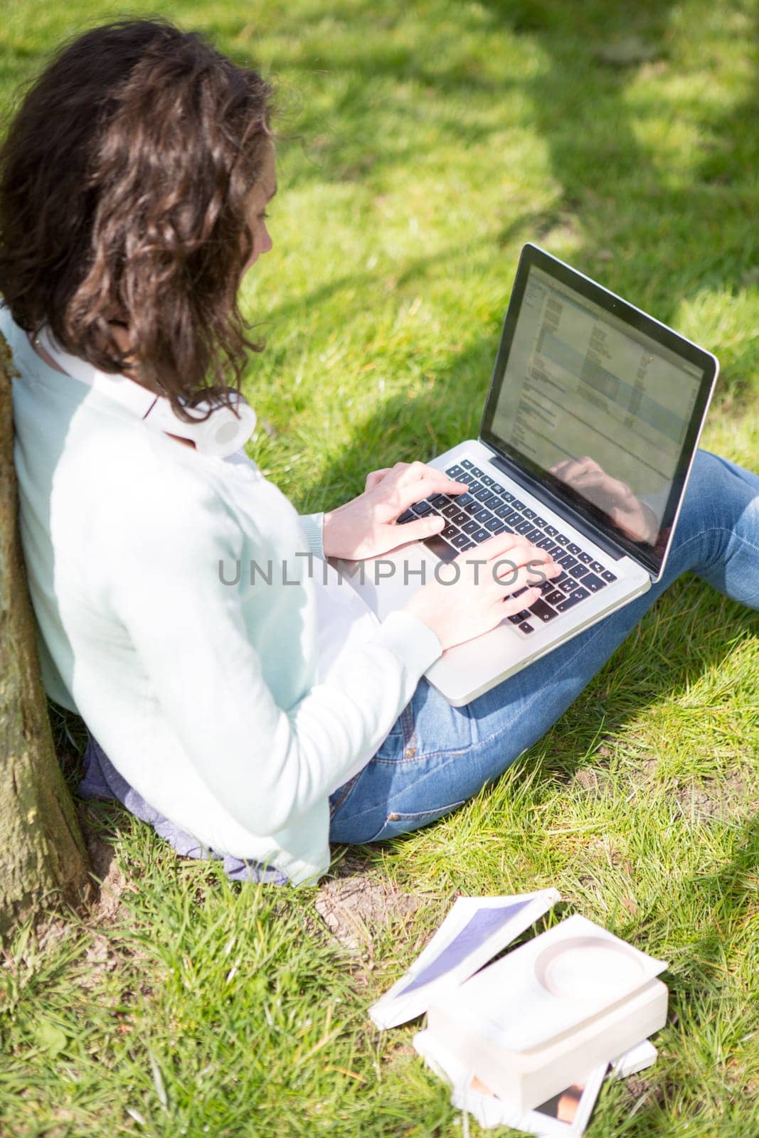 View of a Young attractive woman realxing at the park
