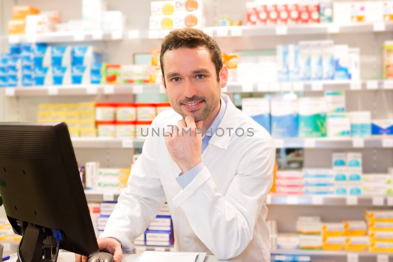 View of an attractive pharmacist at work