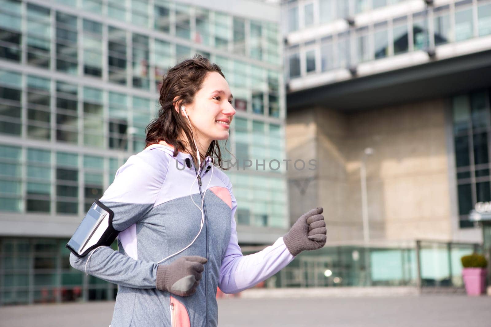 View of a Young attractive woman running downtown
