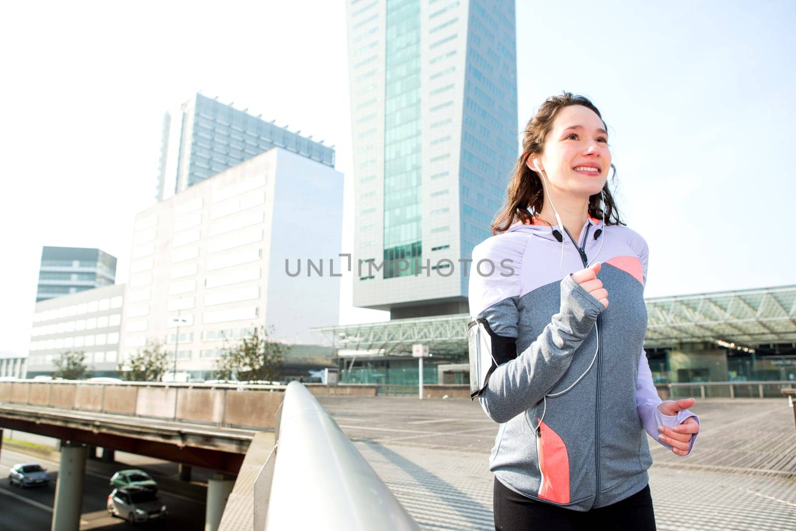 View of a Young attractive woman running downtown