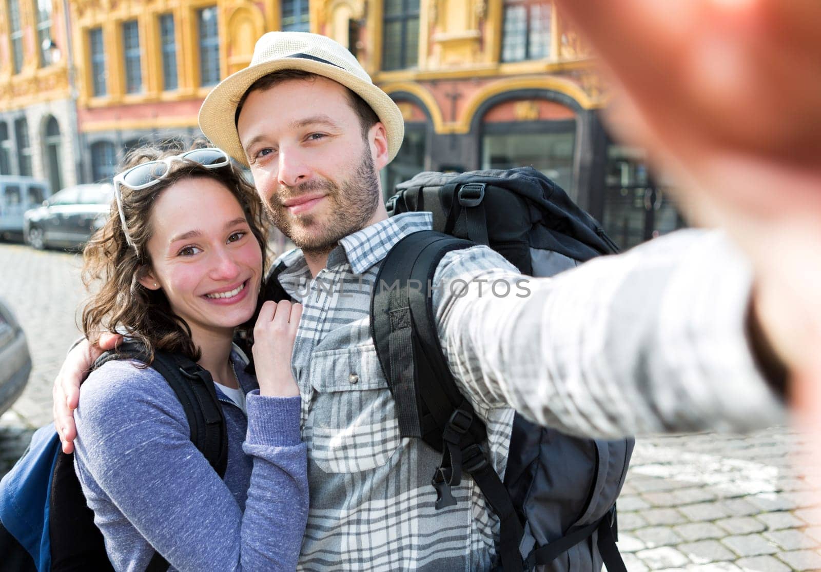 View of a Young couple on holidays taking selfie