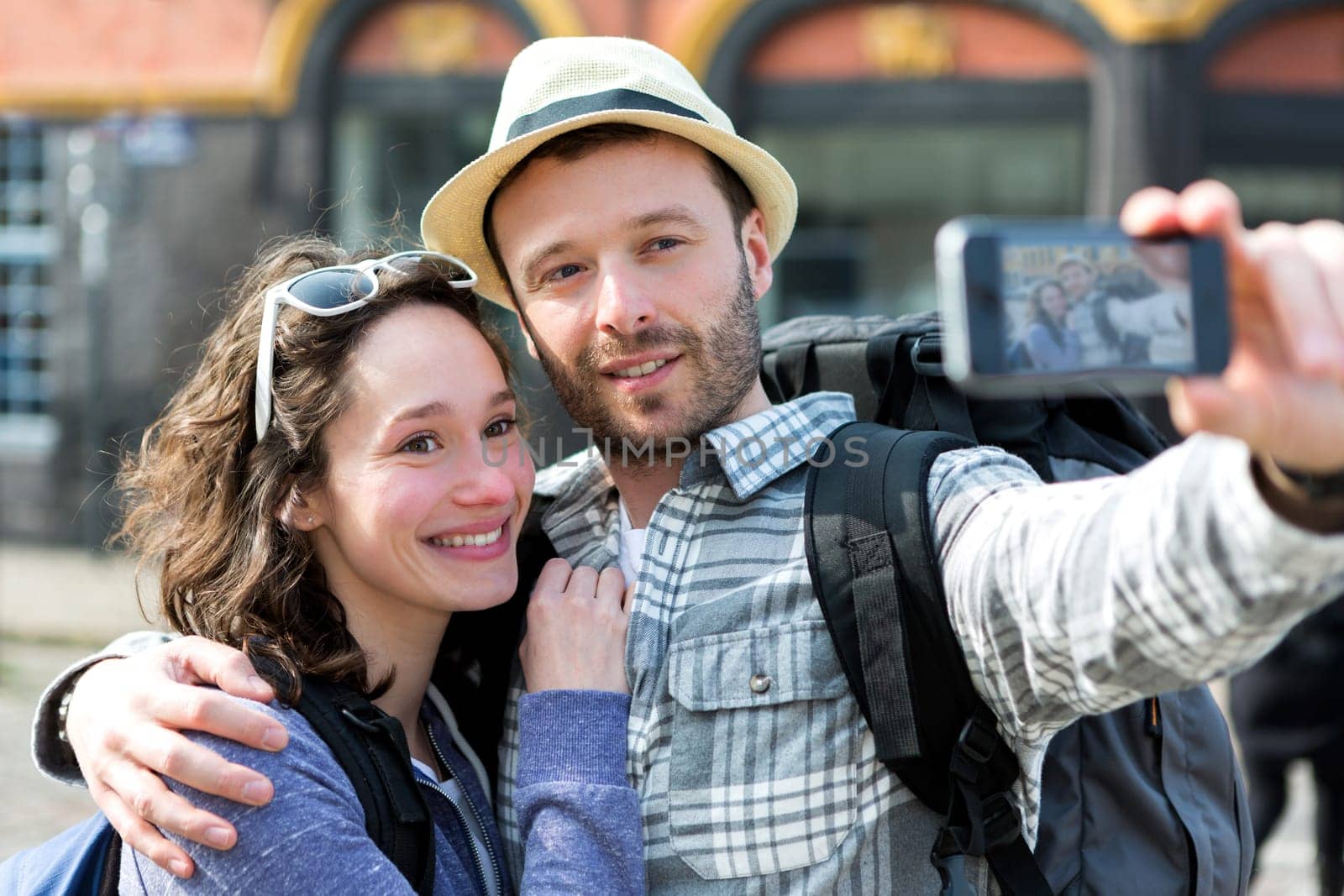 View of a Young couple on holidays taking selfie