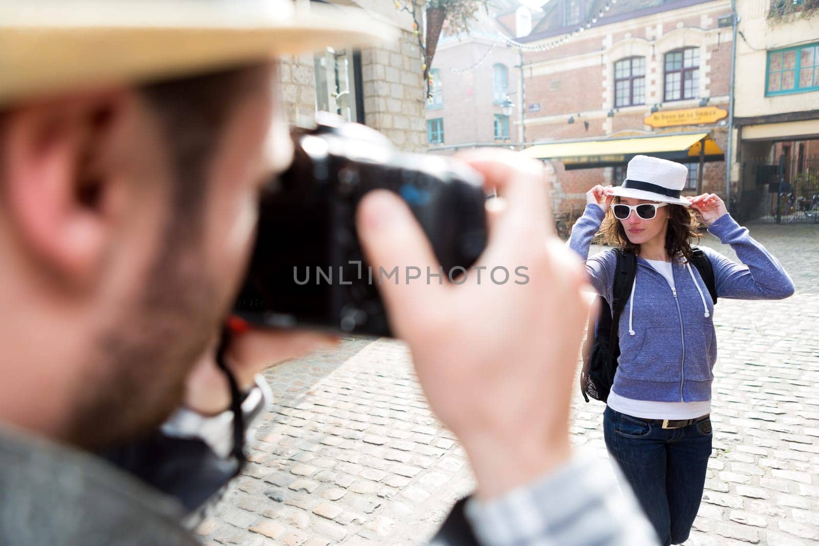 View of a Man taking picture of his girlfriend on hoildays