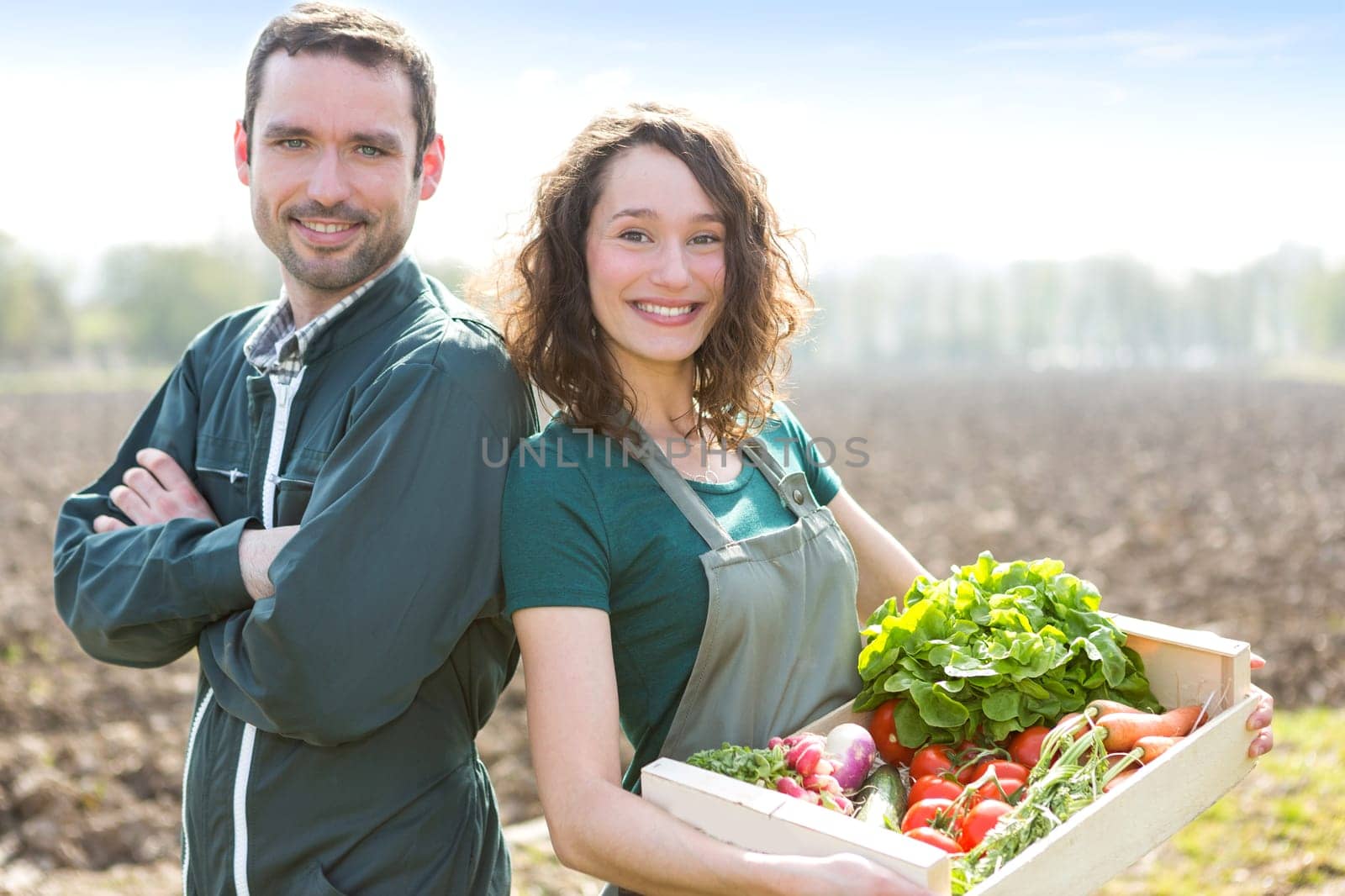 VIew of a Farmer team at work in a field
