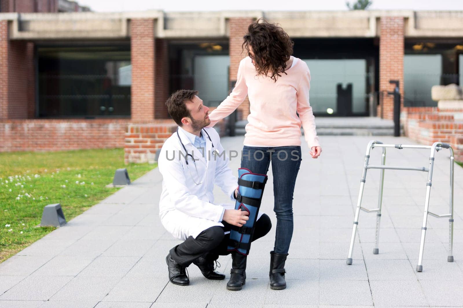 View of a Young doctor assisting a young woman
