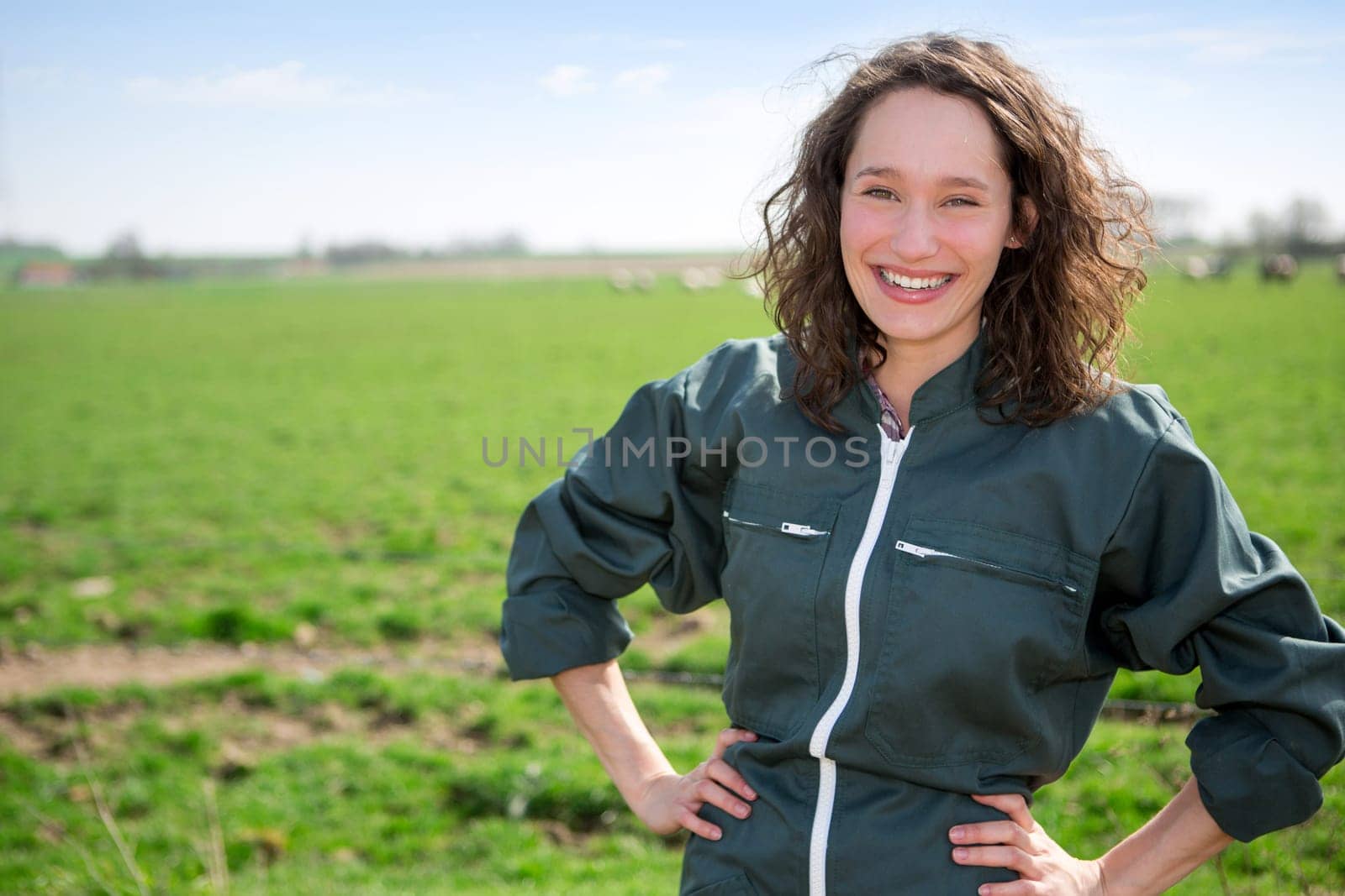 View of a young attractive farmer in fields