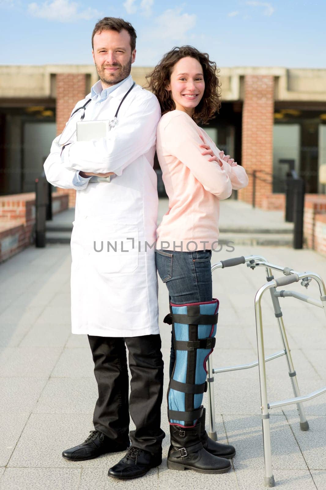 View of a Young attractive patient and a doctor after a reeducation session