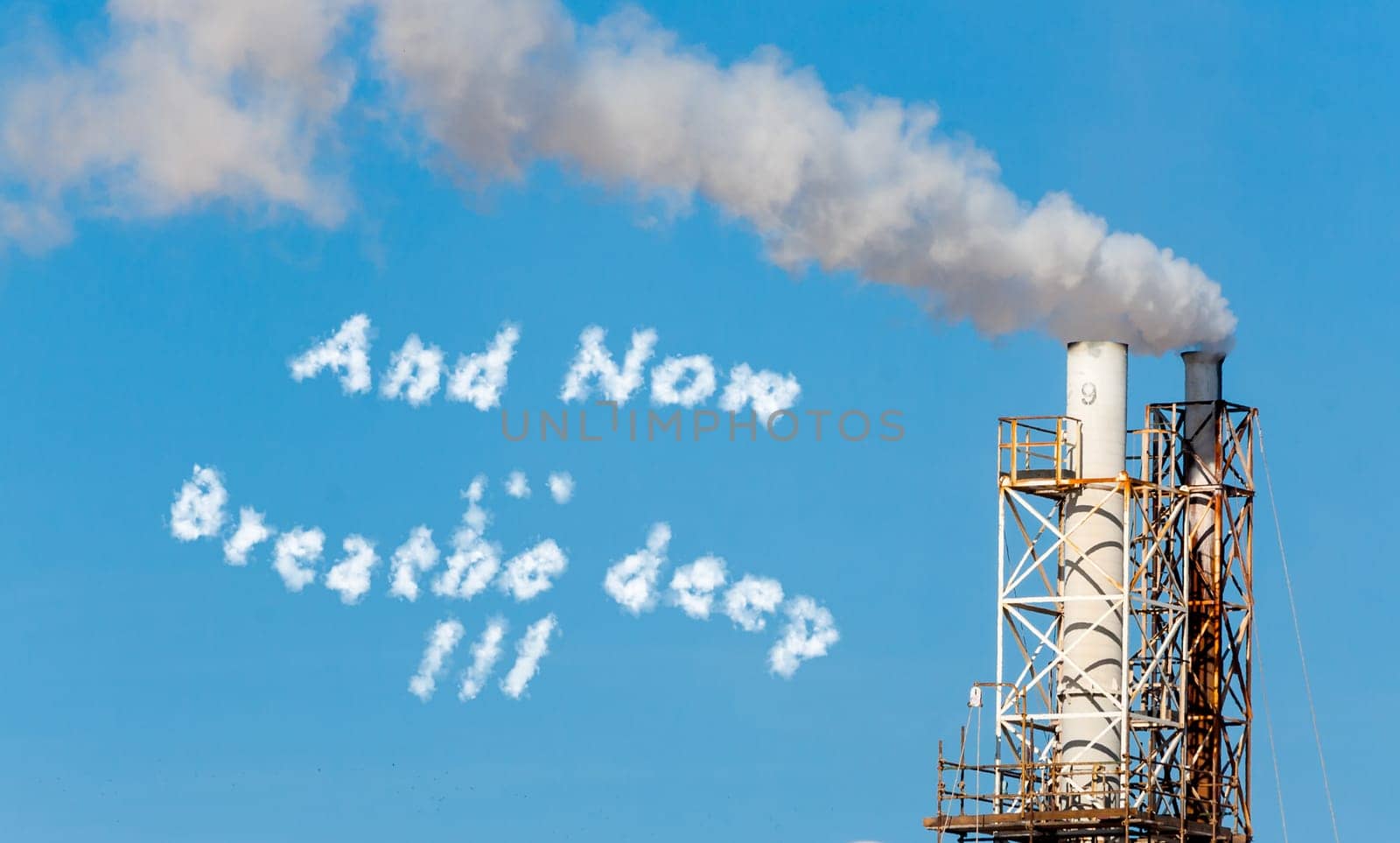 White smoke in the blue sky with written in cloud text.