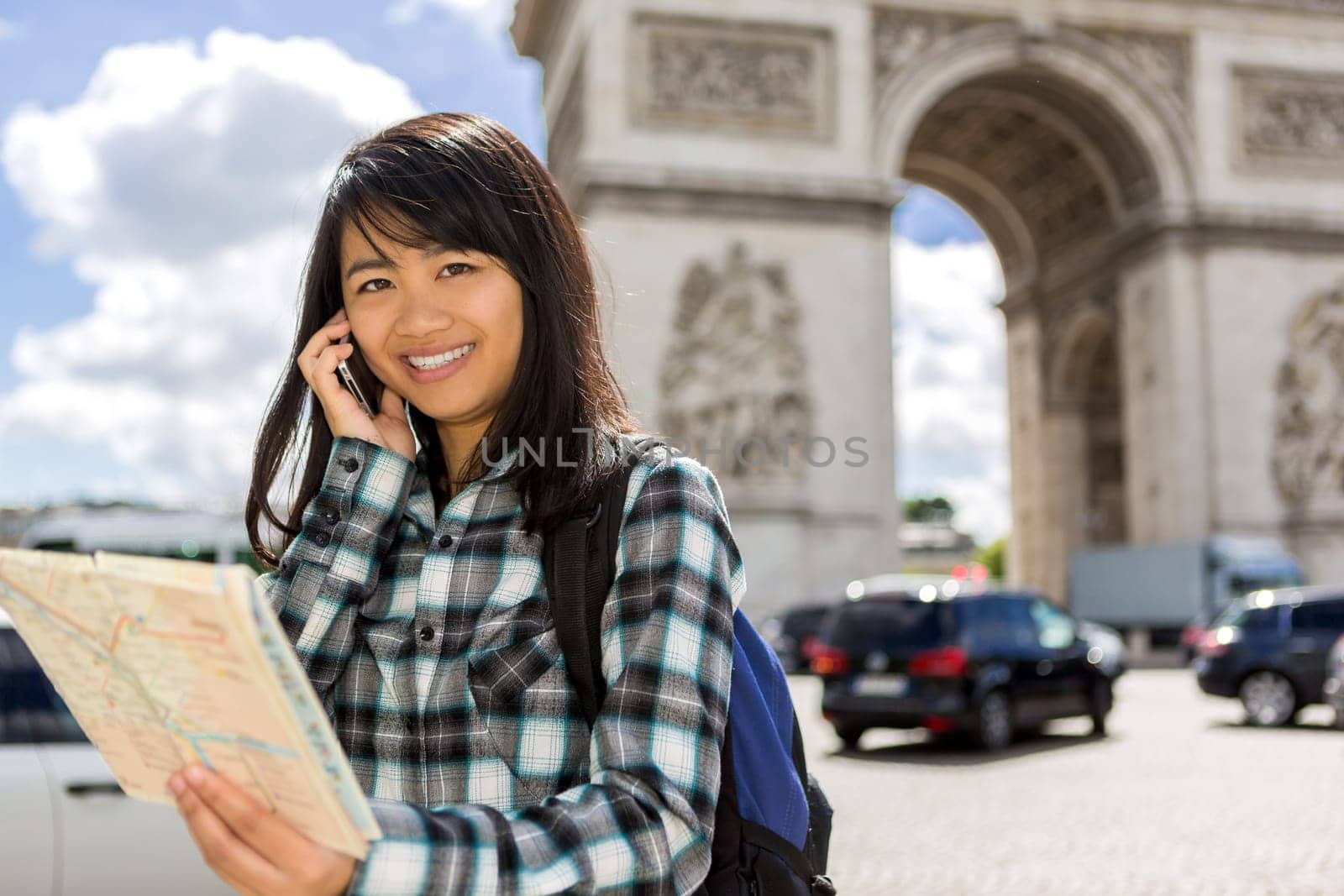 View of a Young attractive asian tourist visiting Paris