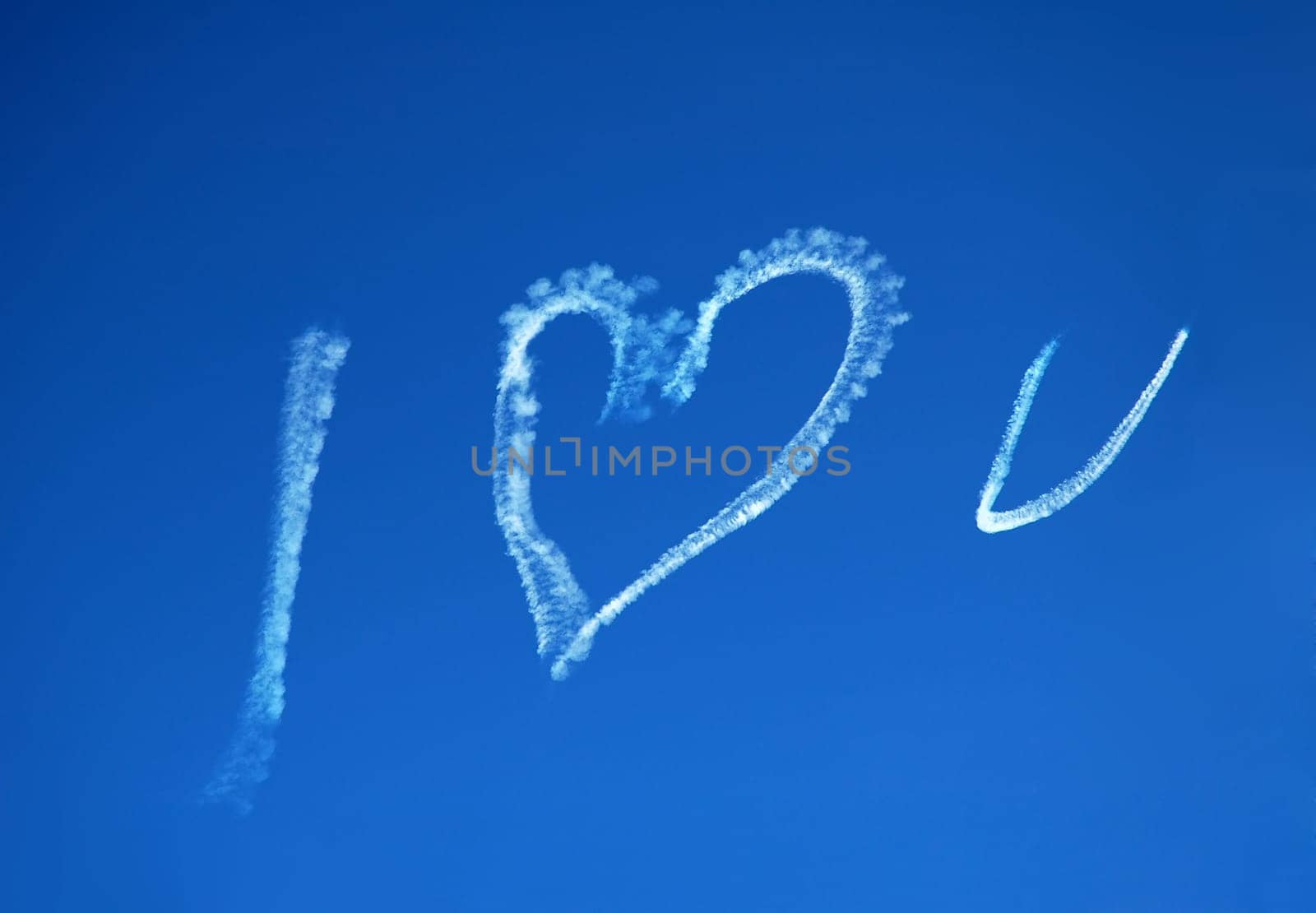 blue sky, white text created with a jet: I LOVE U