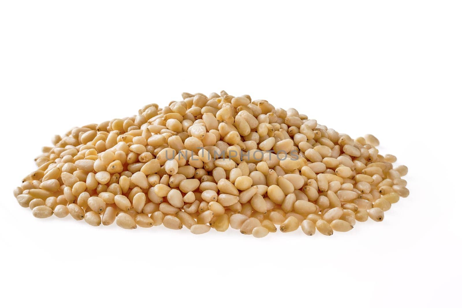 Heap of pine nuts isolated on white