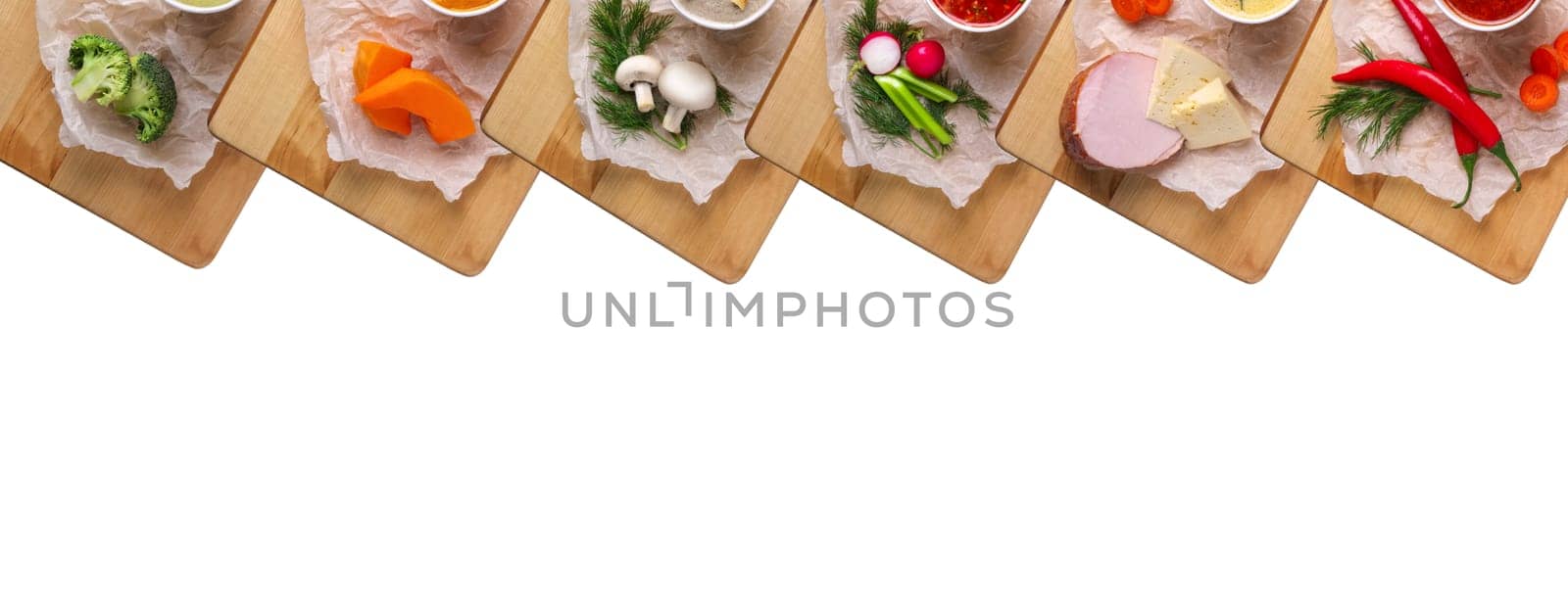 Variety of colorful vegetables and ingredients for cream soups top view isolated on white
